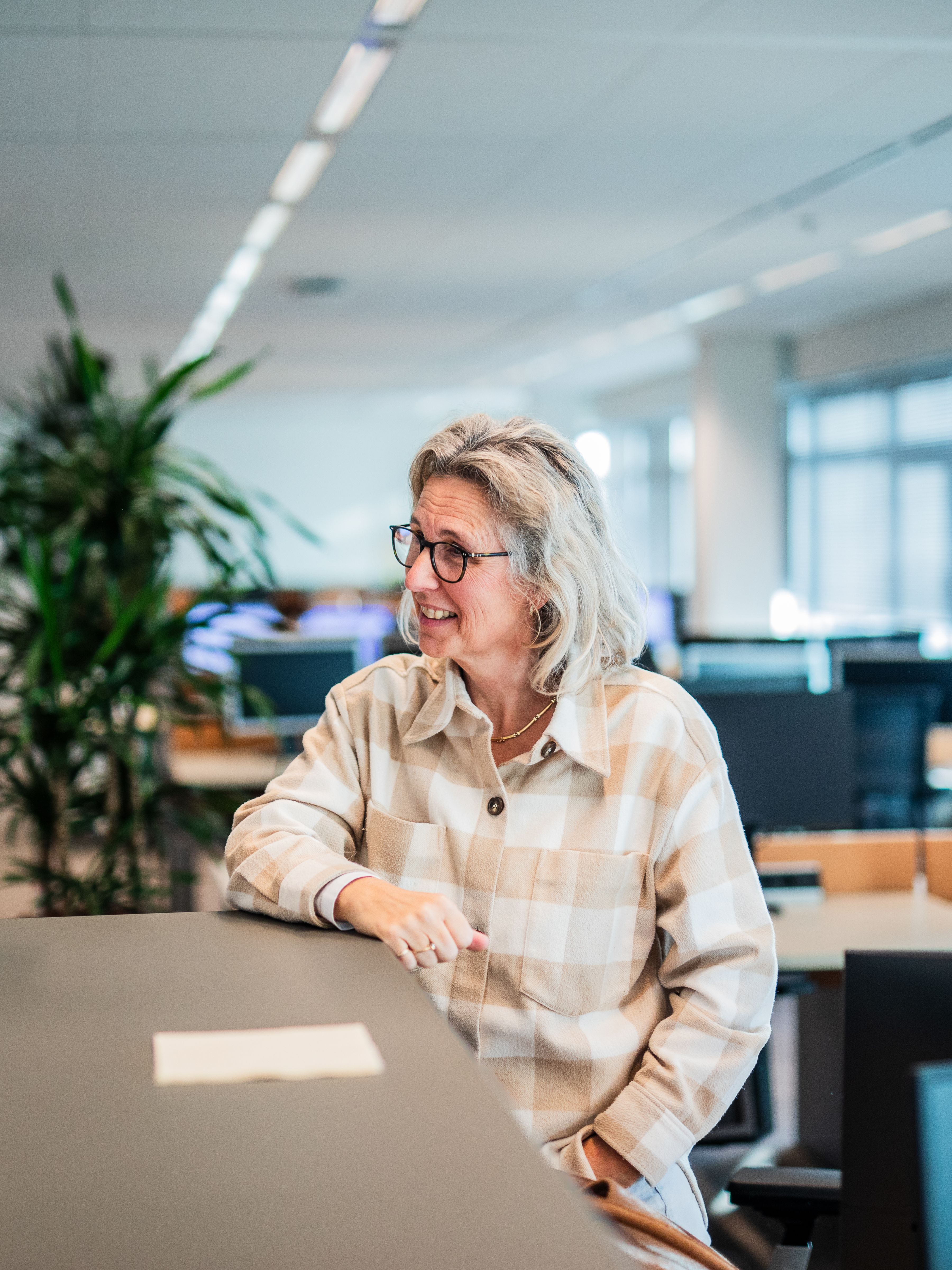 Man and woman having a discussion at table.