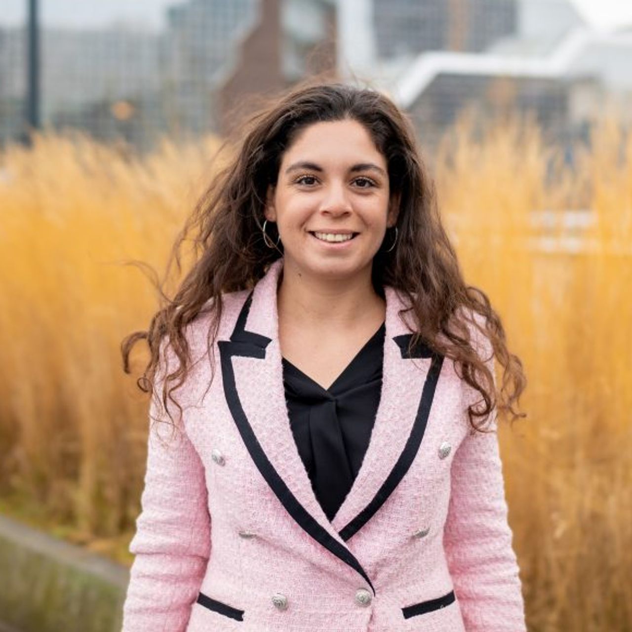 Young female professional in front of a Rabobank office