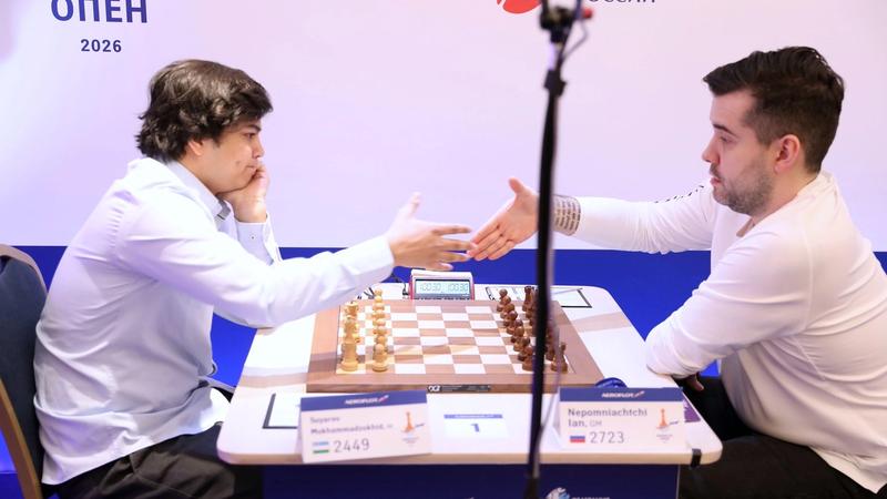 Tournament winner Nepo shaking hands in the final round.