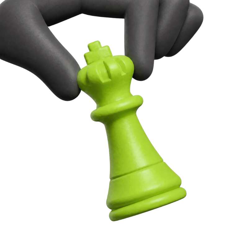 A hand picking up a green chess king