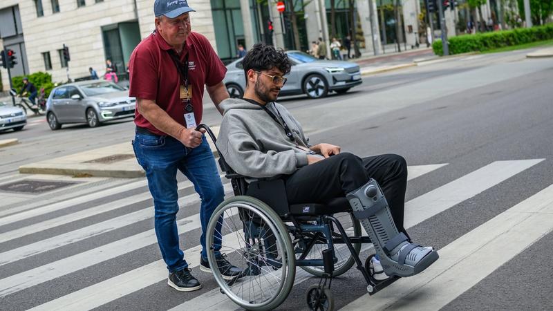 Firouzja being wheeled to the venue.