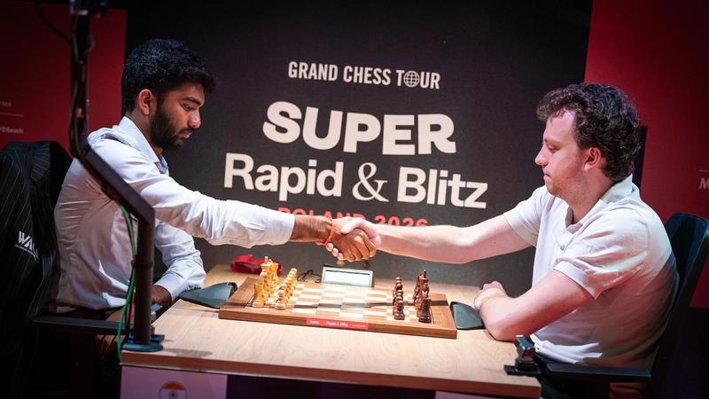 Niemann (right) taking on World Champion Gukesh D in Warsaw.