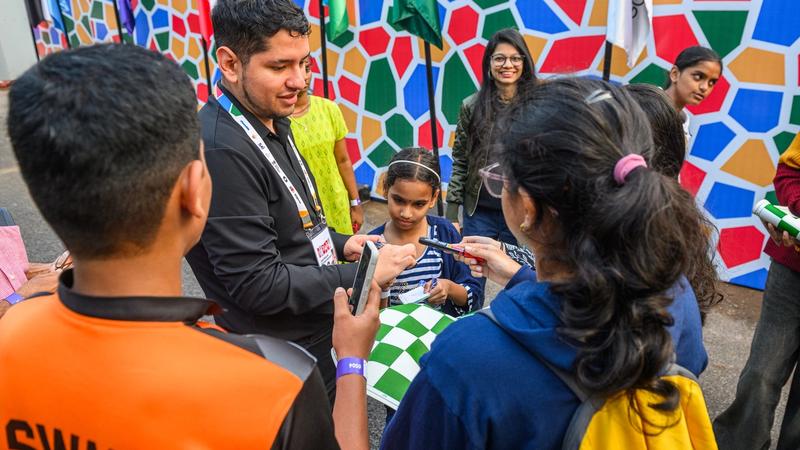 GM Jose Martinez signs autographs after his World Cup win.