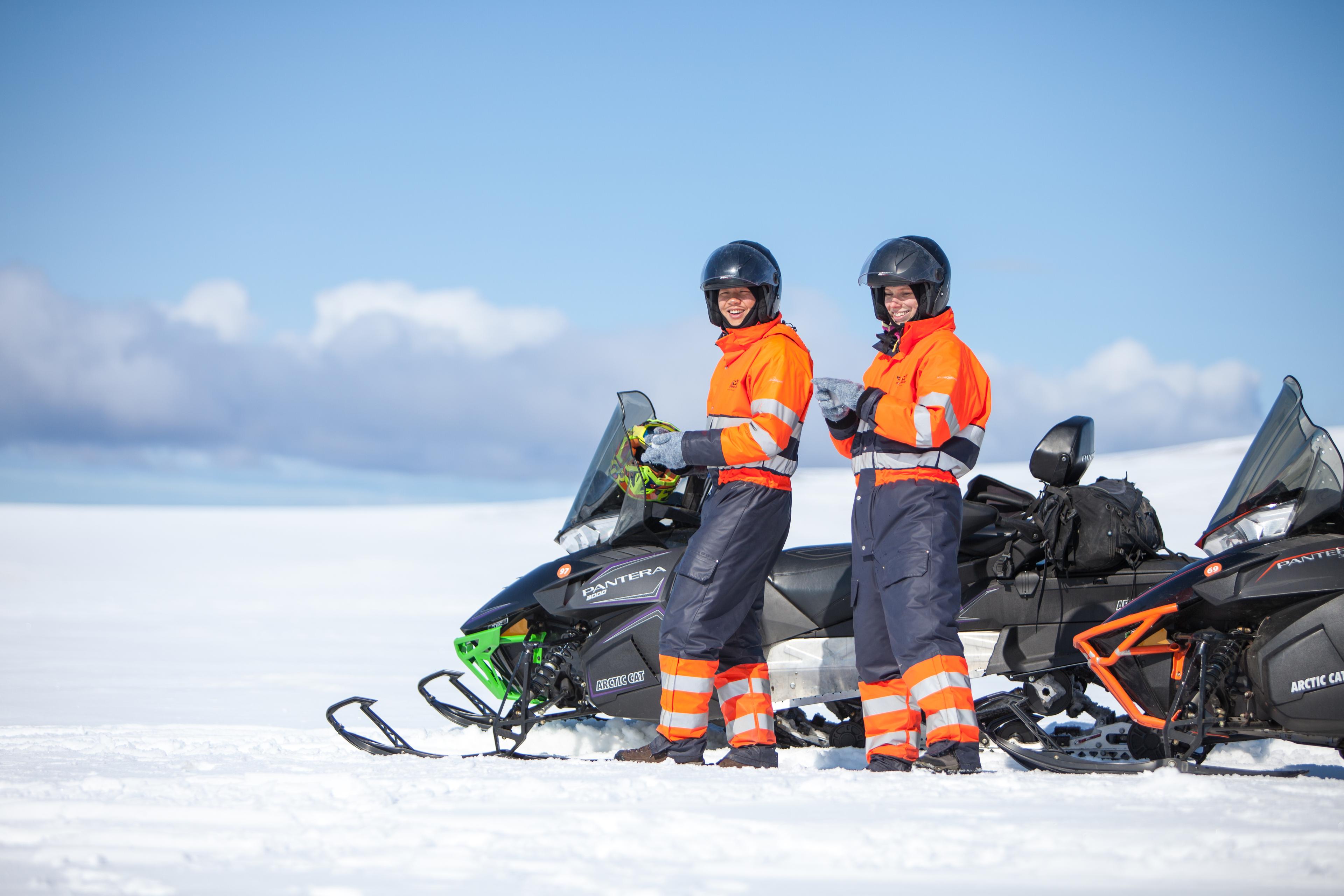 Two people enjoying their time on the top of the glacier