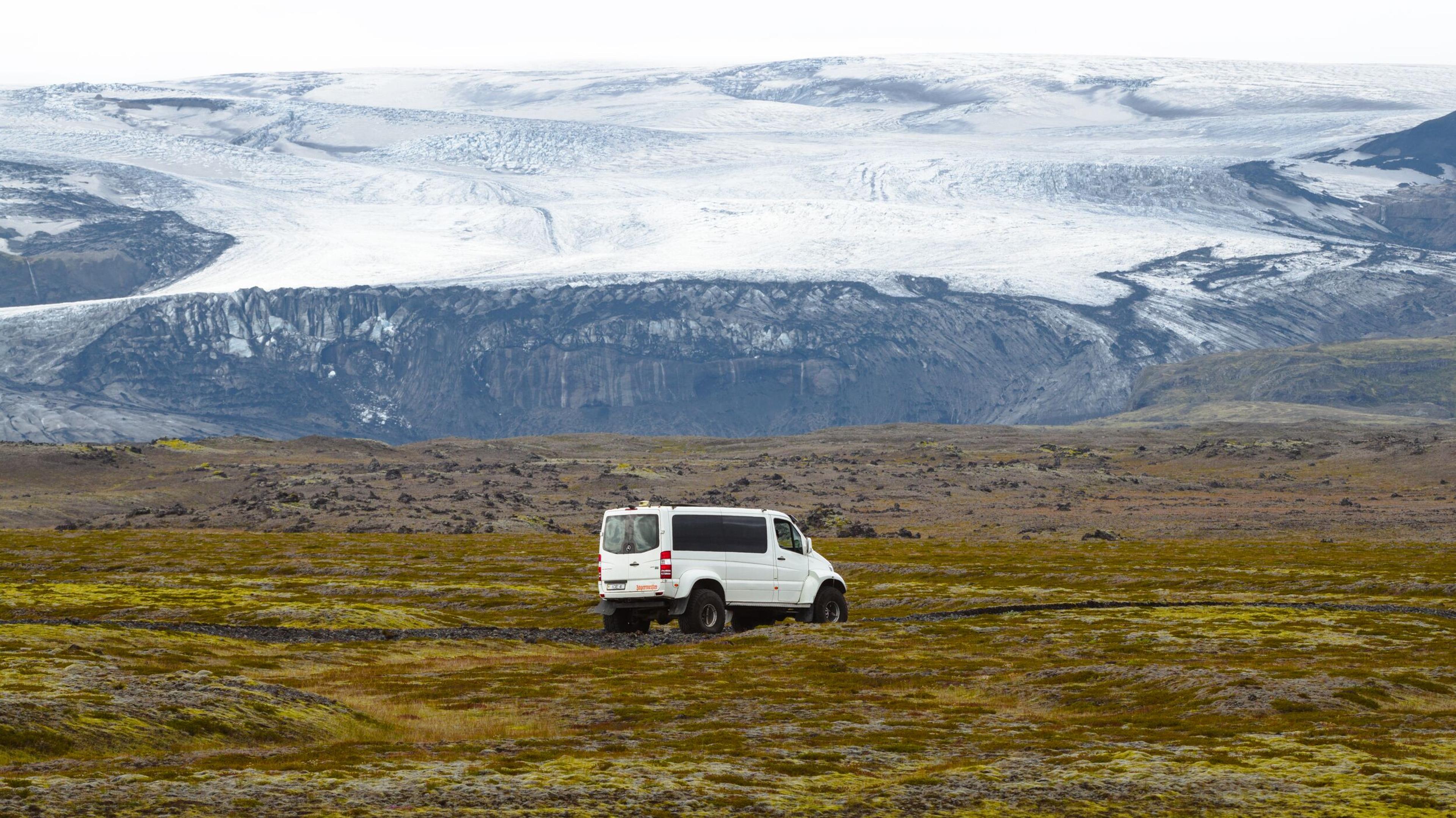 A truck below the magnificent Mýrdalsjökull glacier