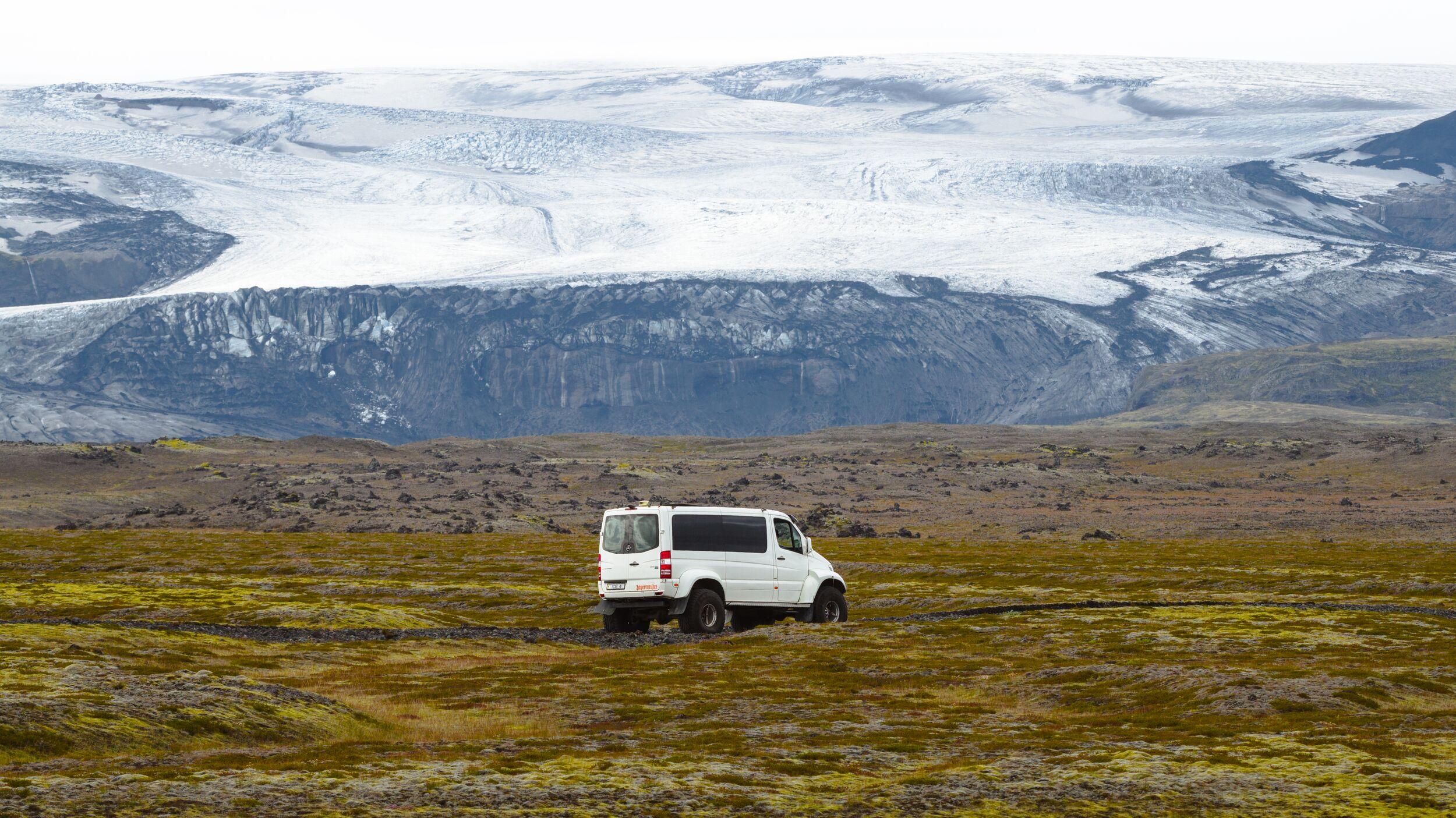 A truck below the magnificent Mýrdalsjökull glacier
