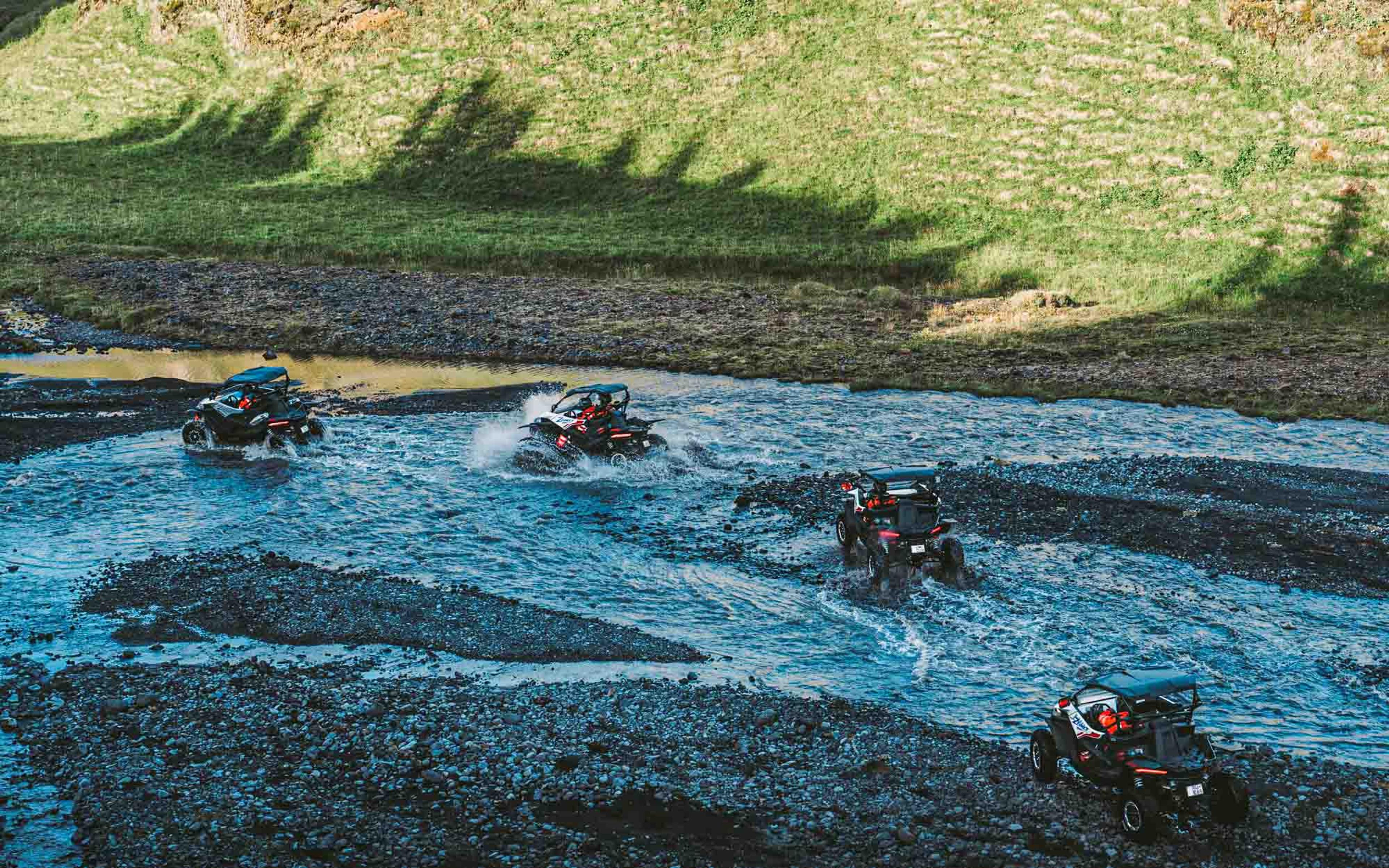 Buggies crossing a river in Iceland