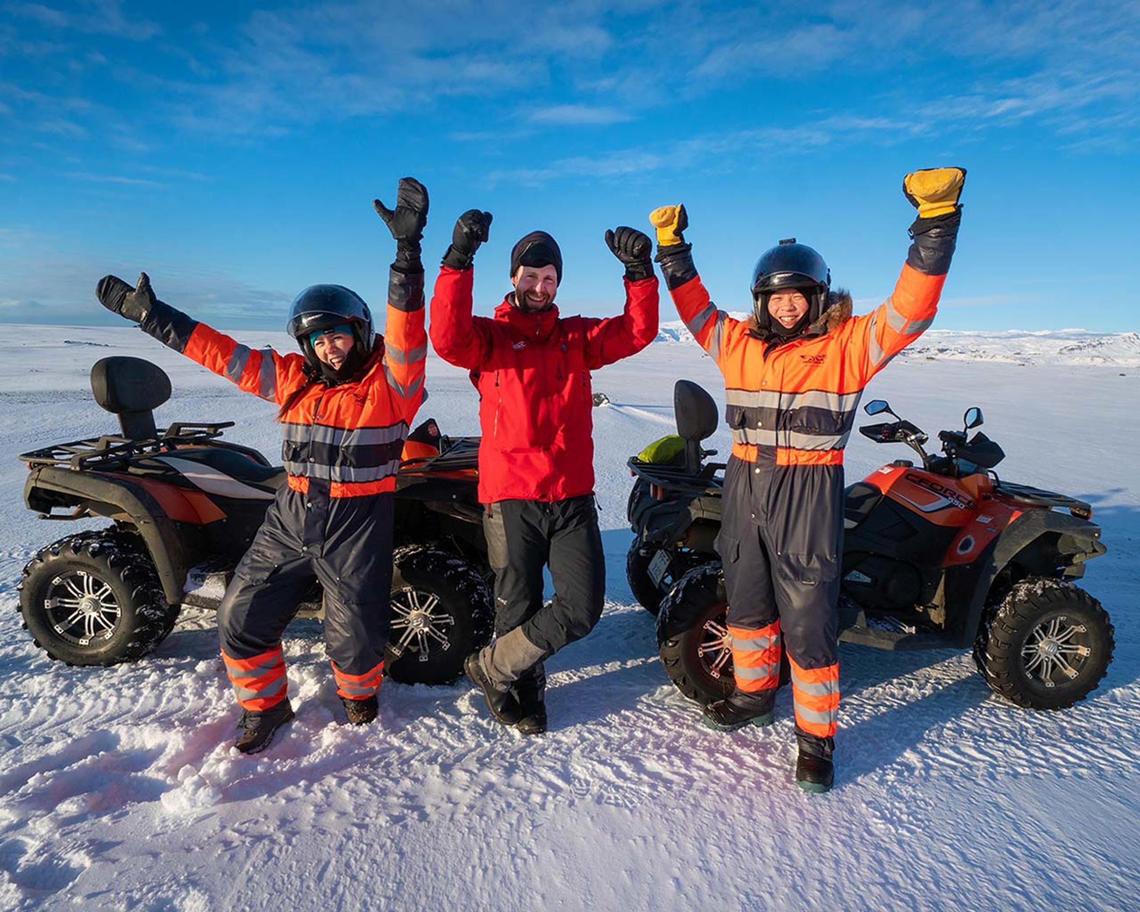 Happy people on a an ATV quad bike tour taking a little break from driving