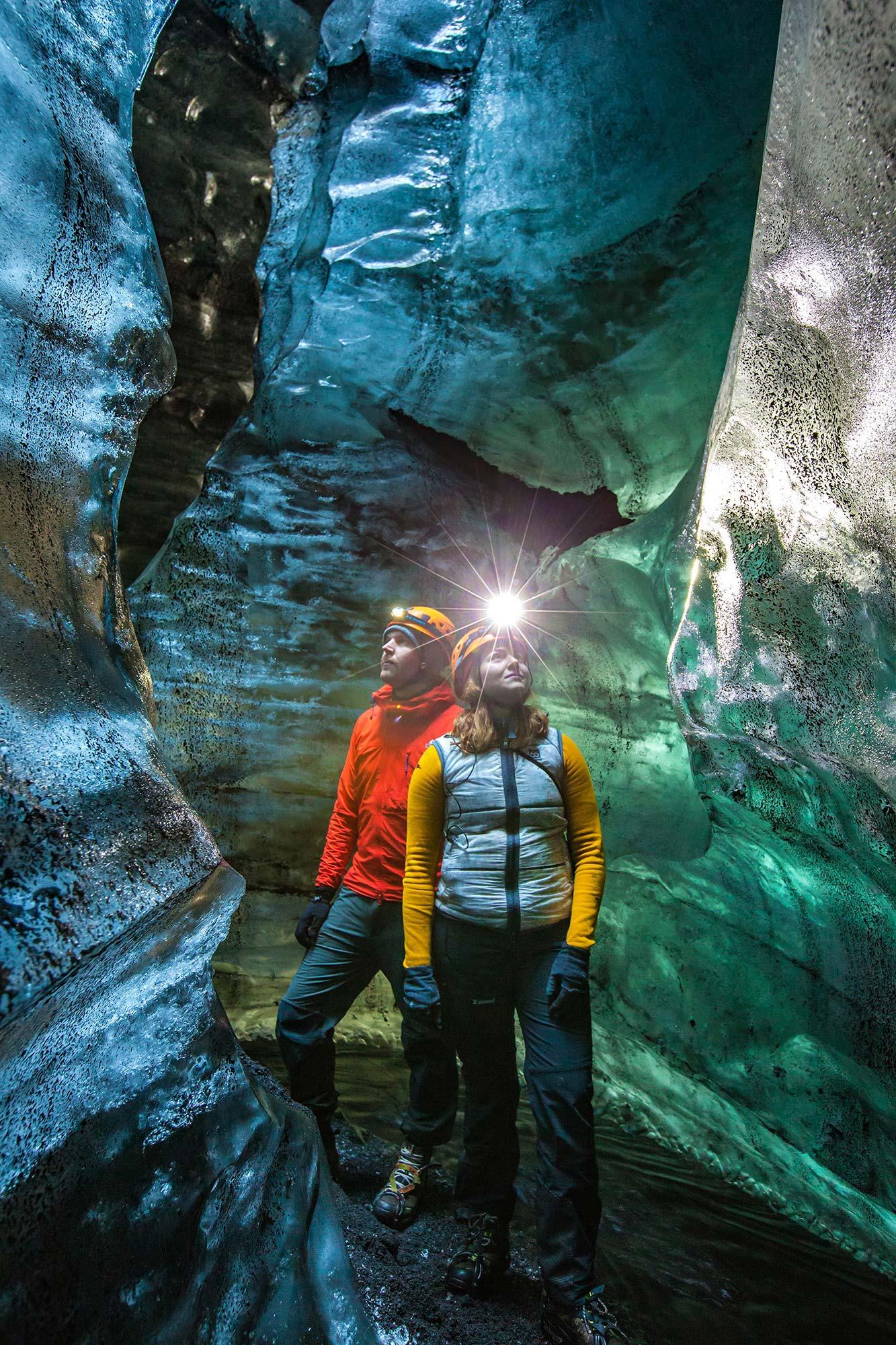Inside the Secret Ice Cave the Icelandic mountain guide leads the way
