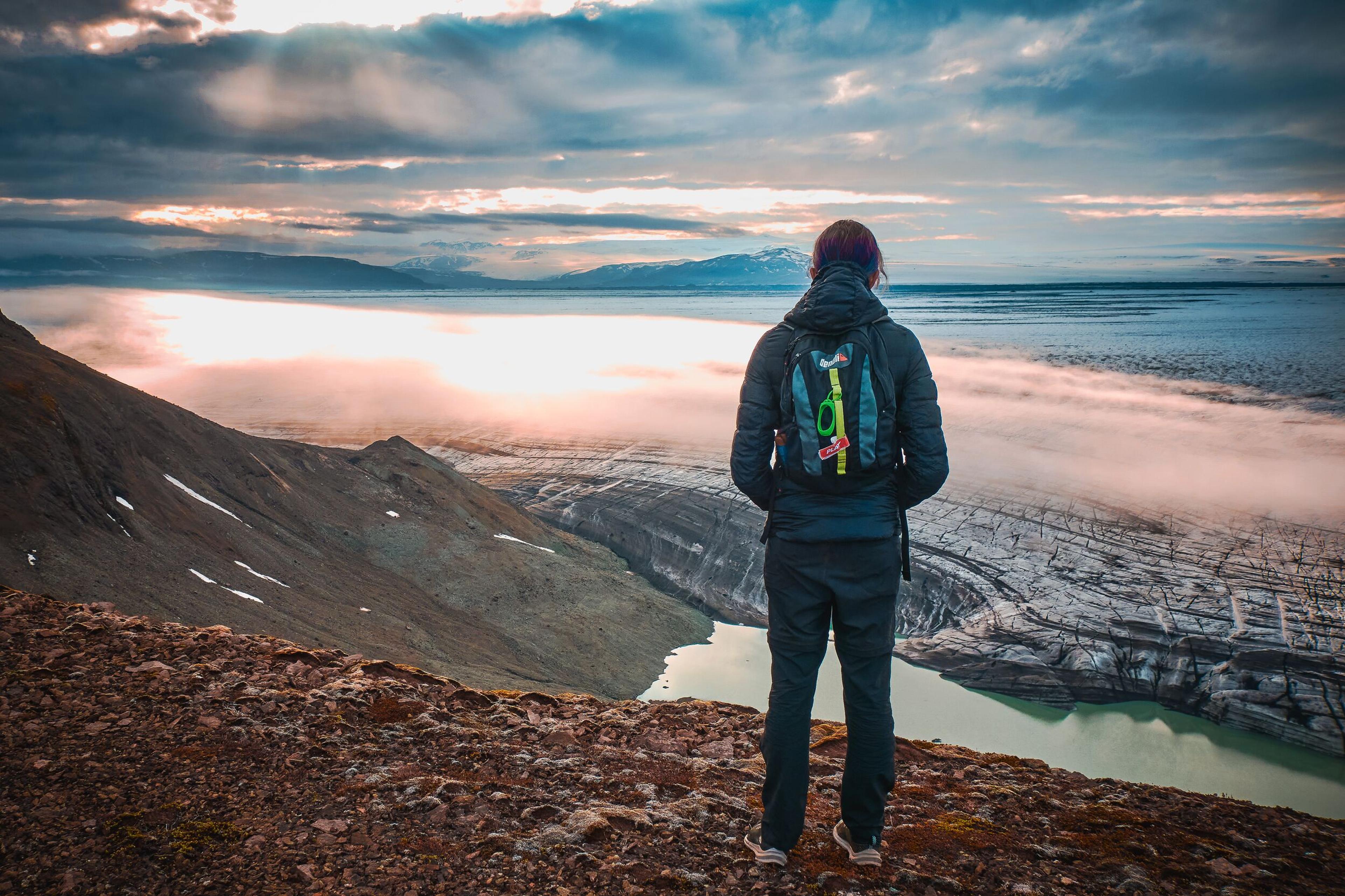 a person enjoying the view over a glacier
