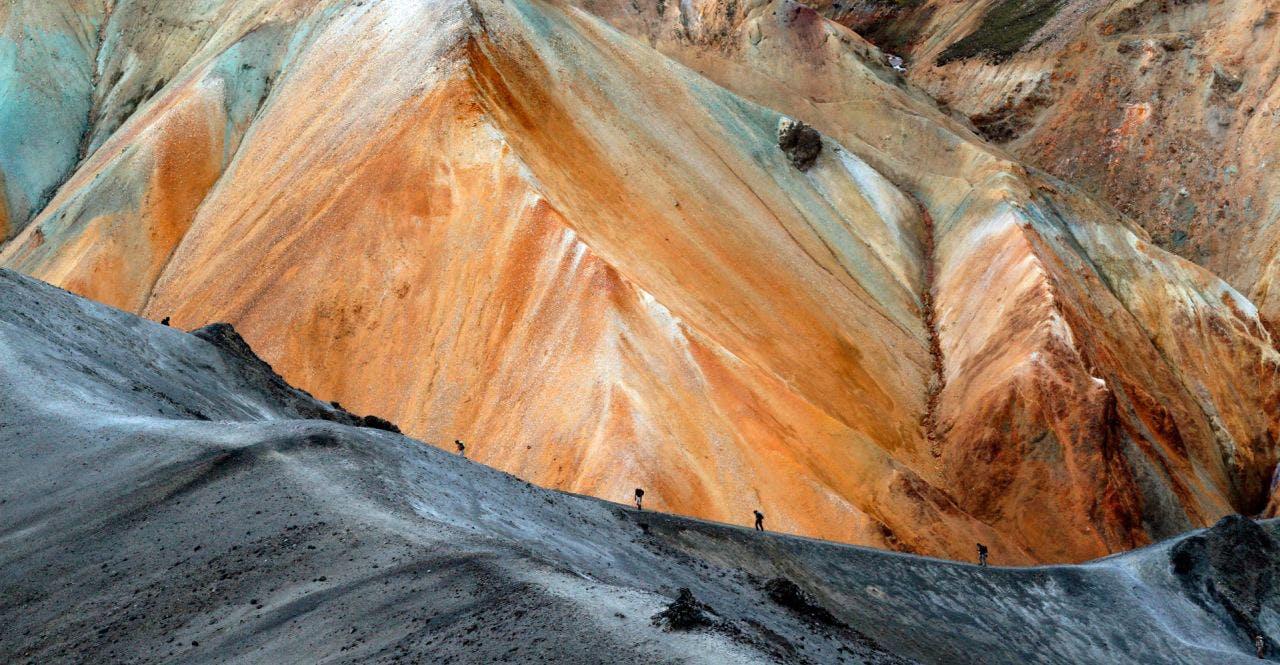 Hikers going up a hill in Landmannalaugar on a tour with Icelandic Mountain Guides