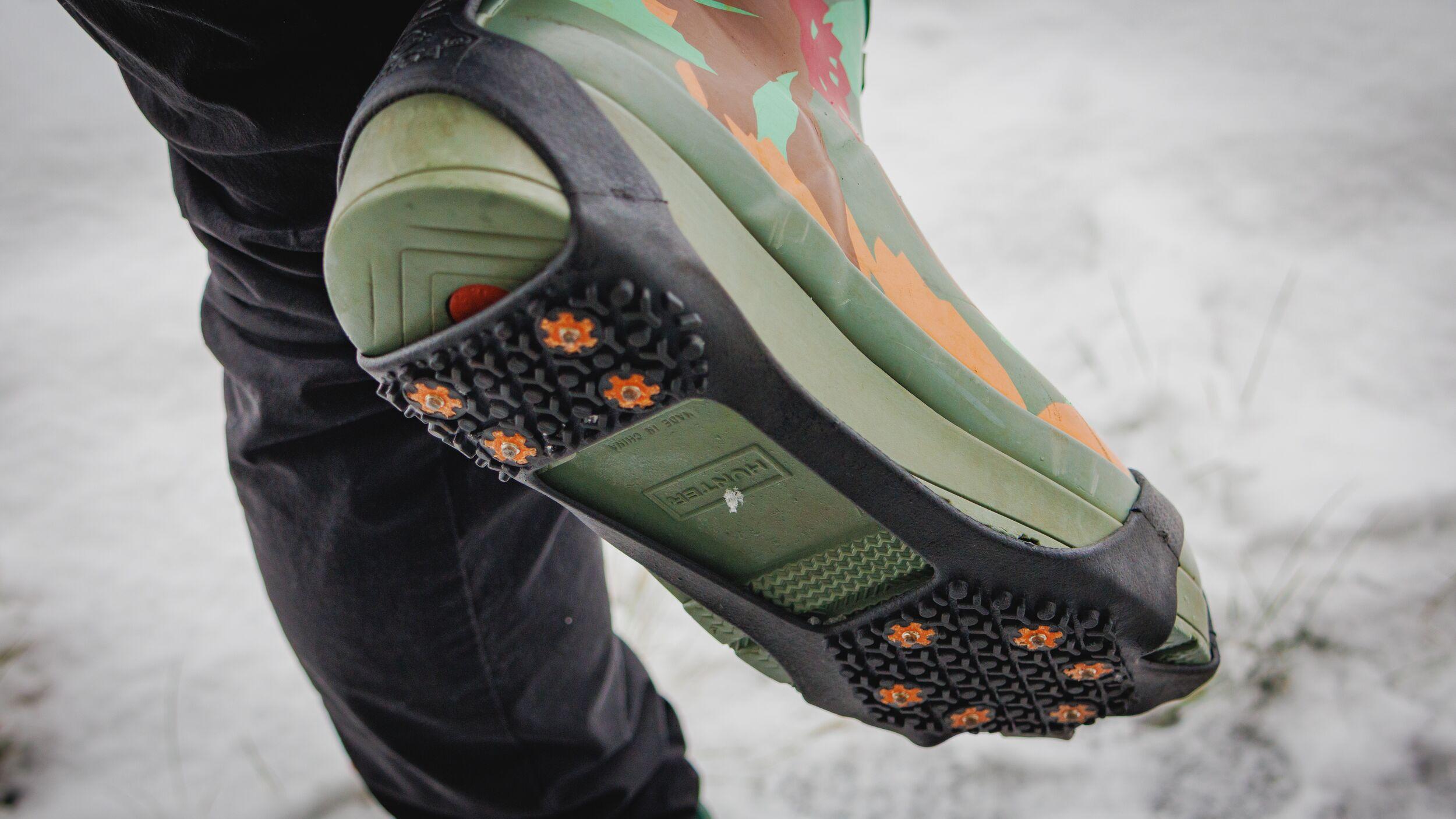 Rubber spiked crampons on boots