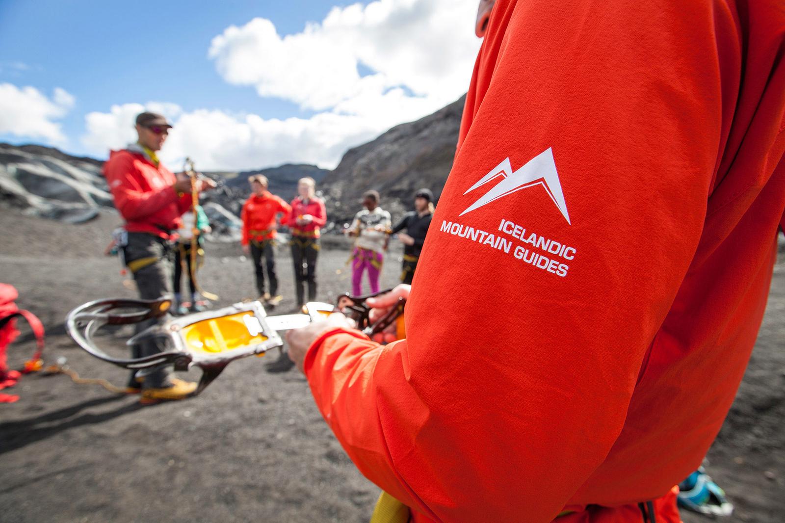 An Icelandic Mountain Guide checking his crampons before glacier walking.