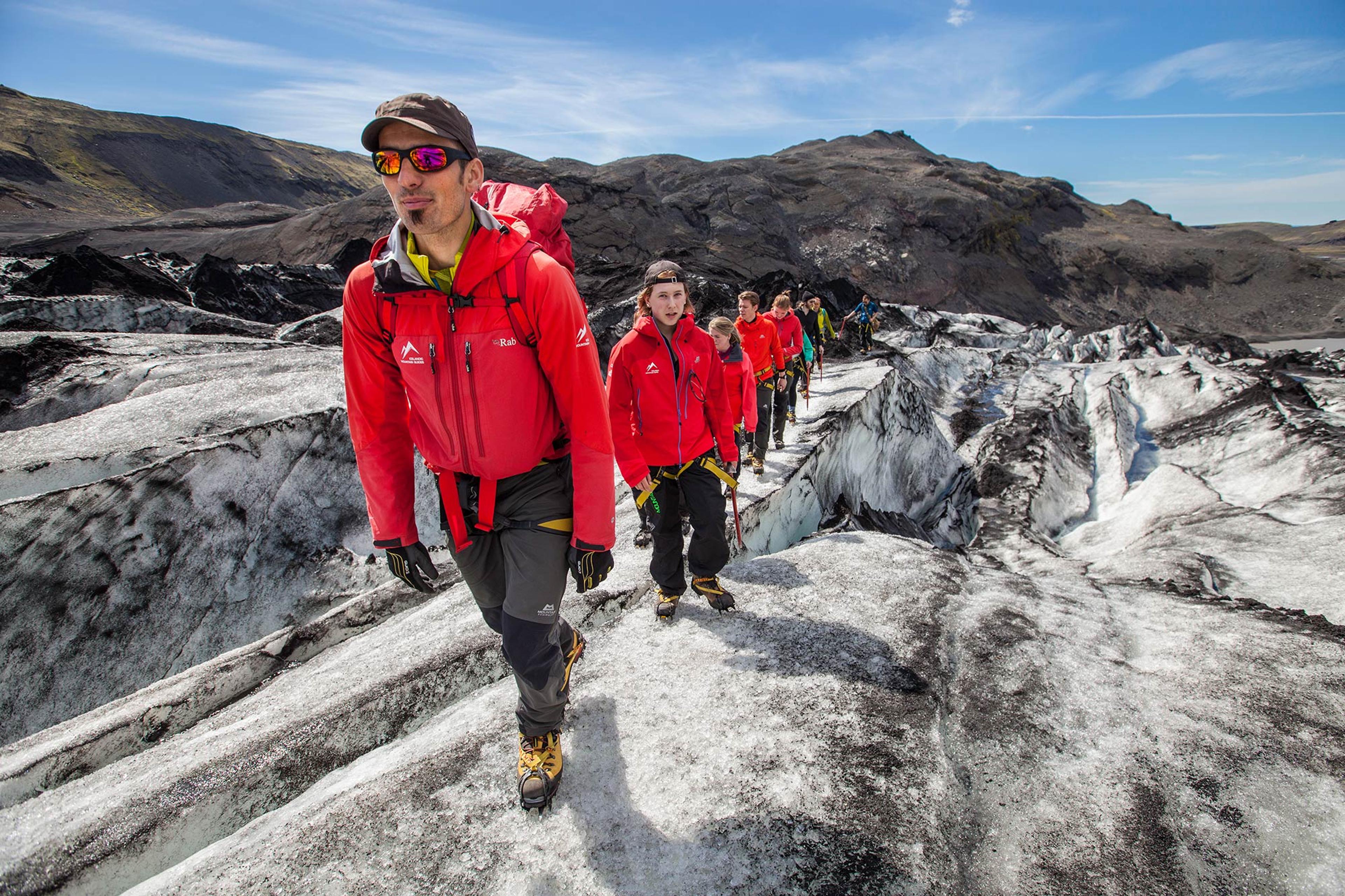 Guide from Icelandic Mountain Guides leading a glacier walk on Sólheimajökull in Iceland