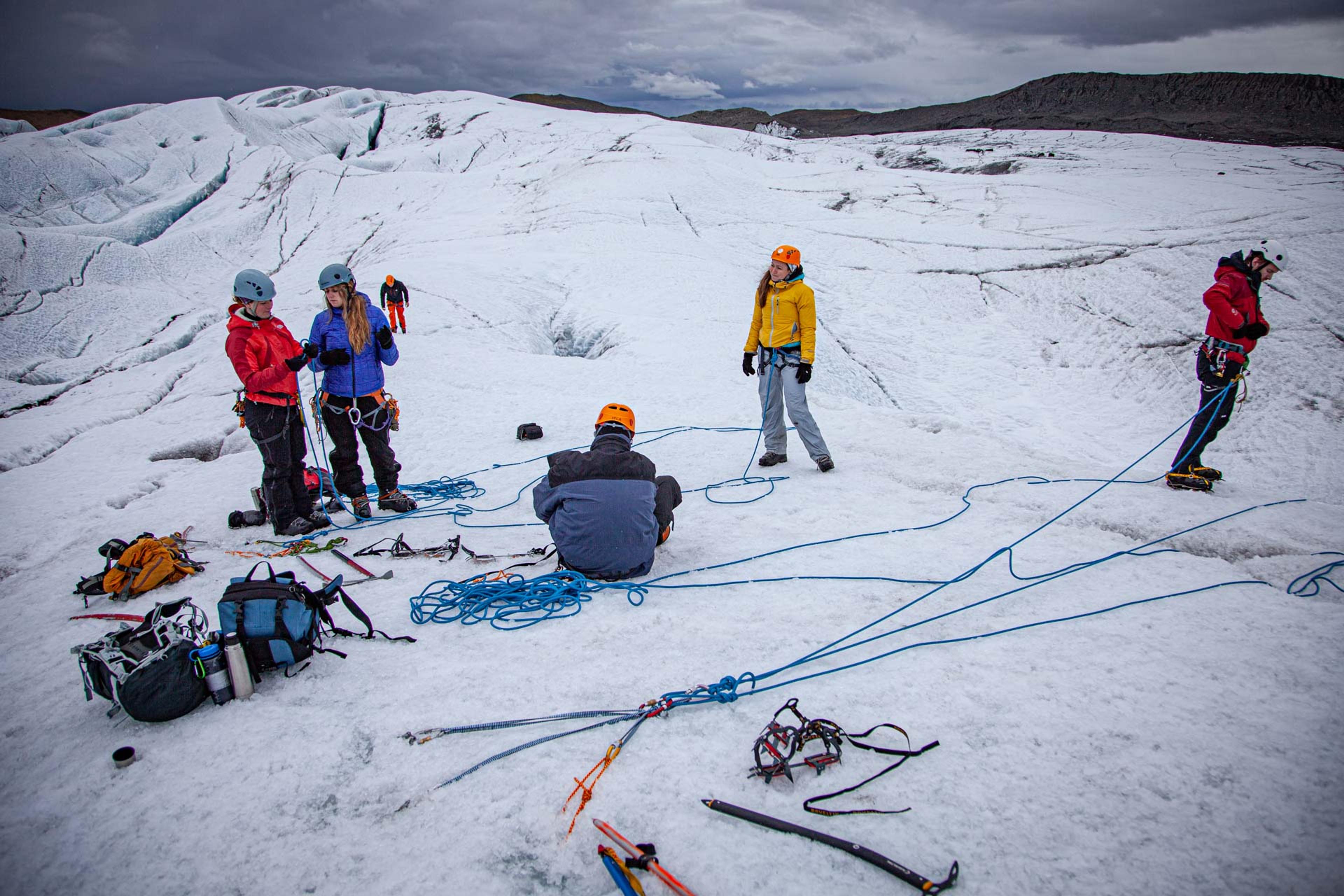 A group of people preparing for the ice climb