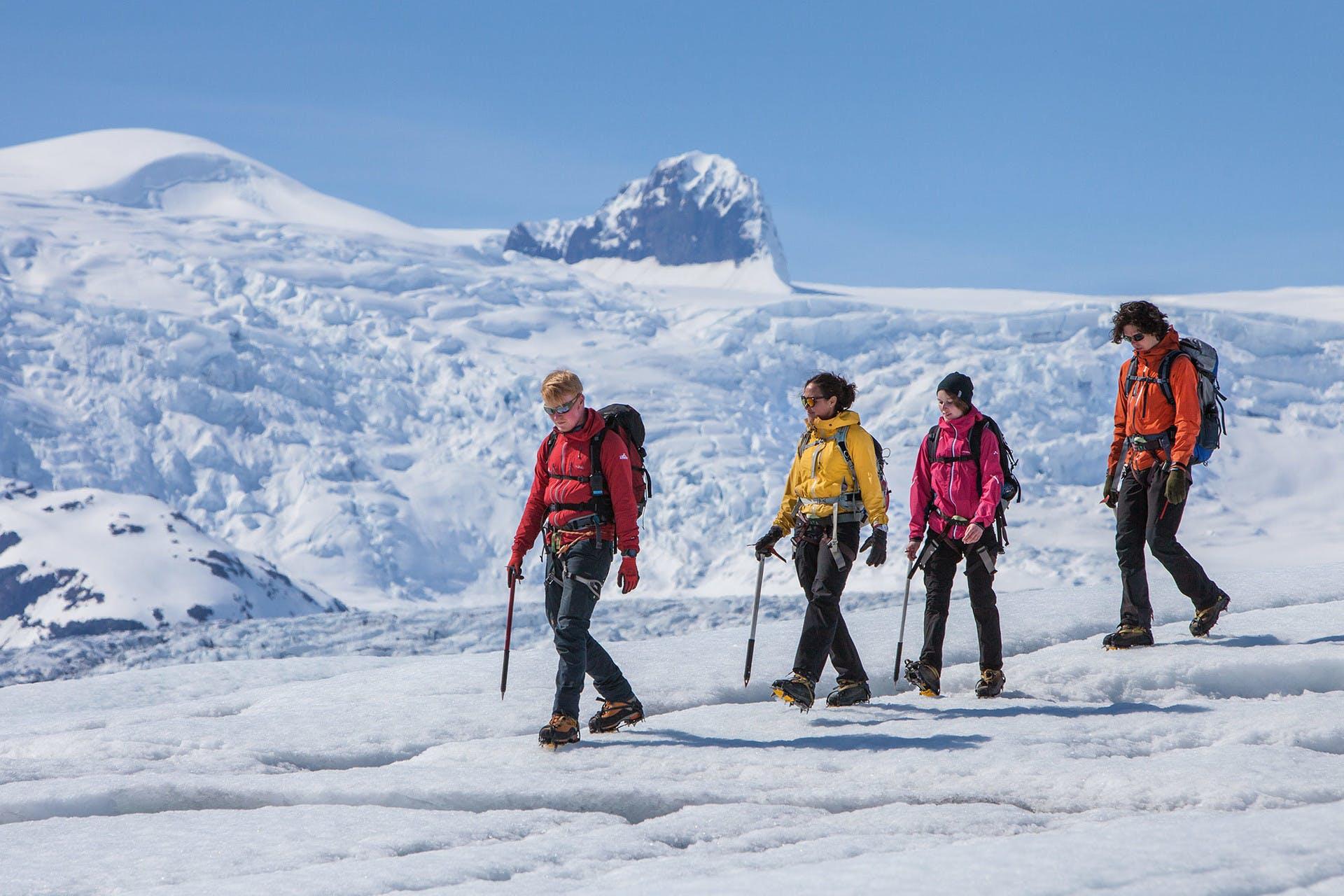 Group on a glacier hike with Hvannadalshnúkur in the background.