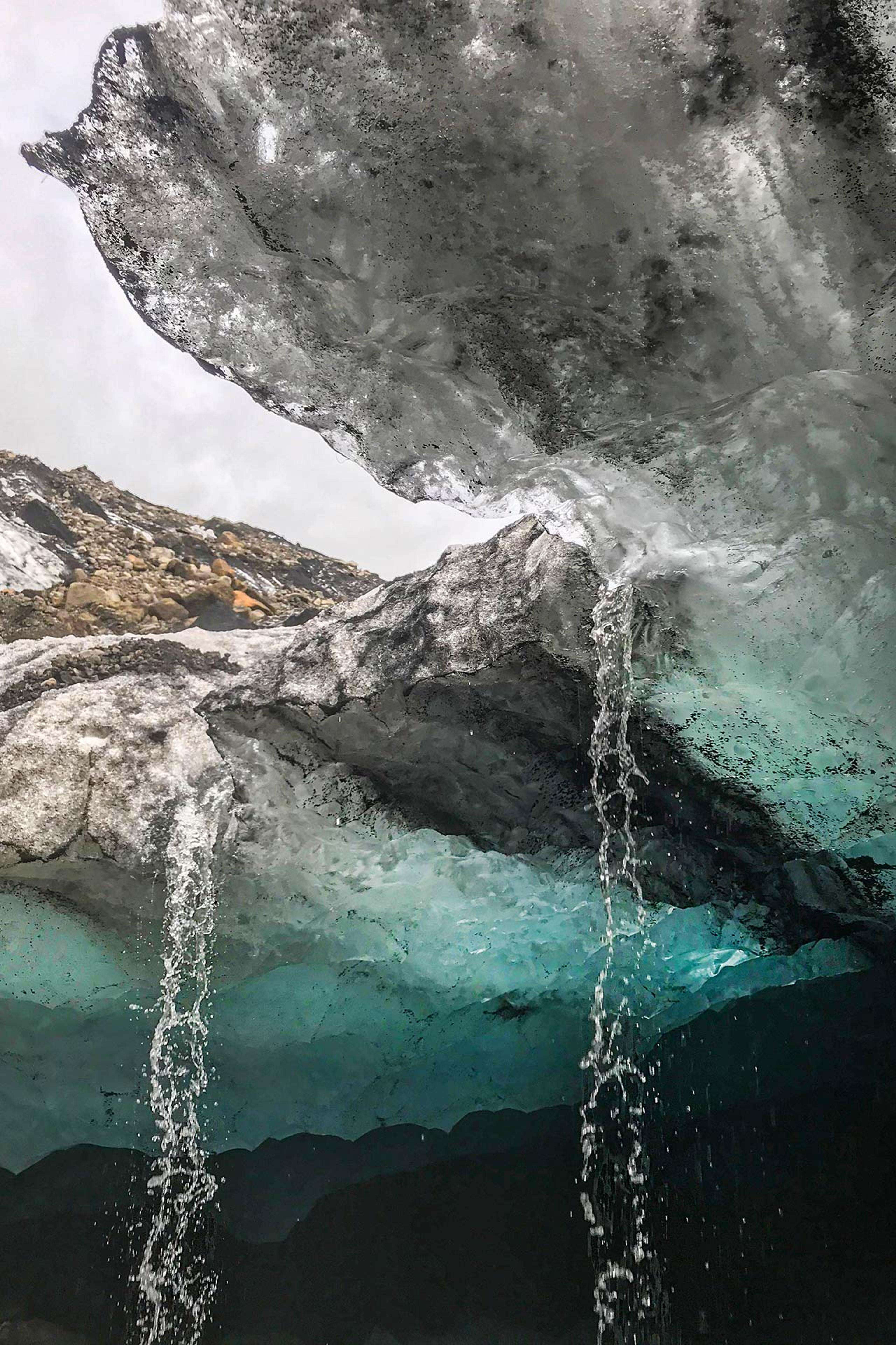 Water flowing down from the roof an ice cave