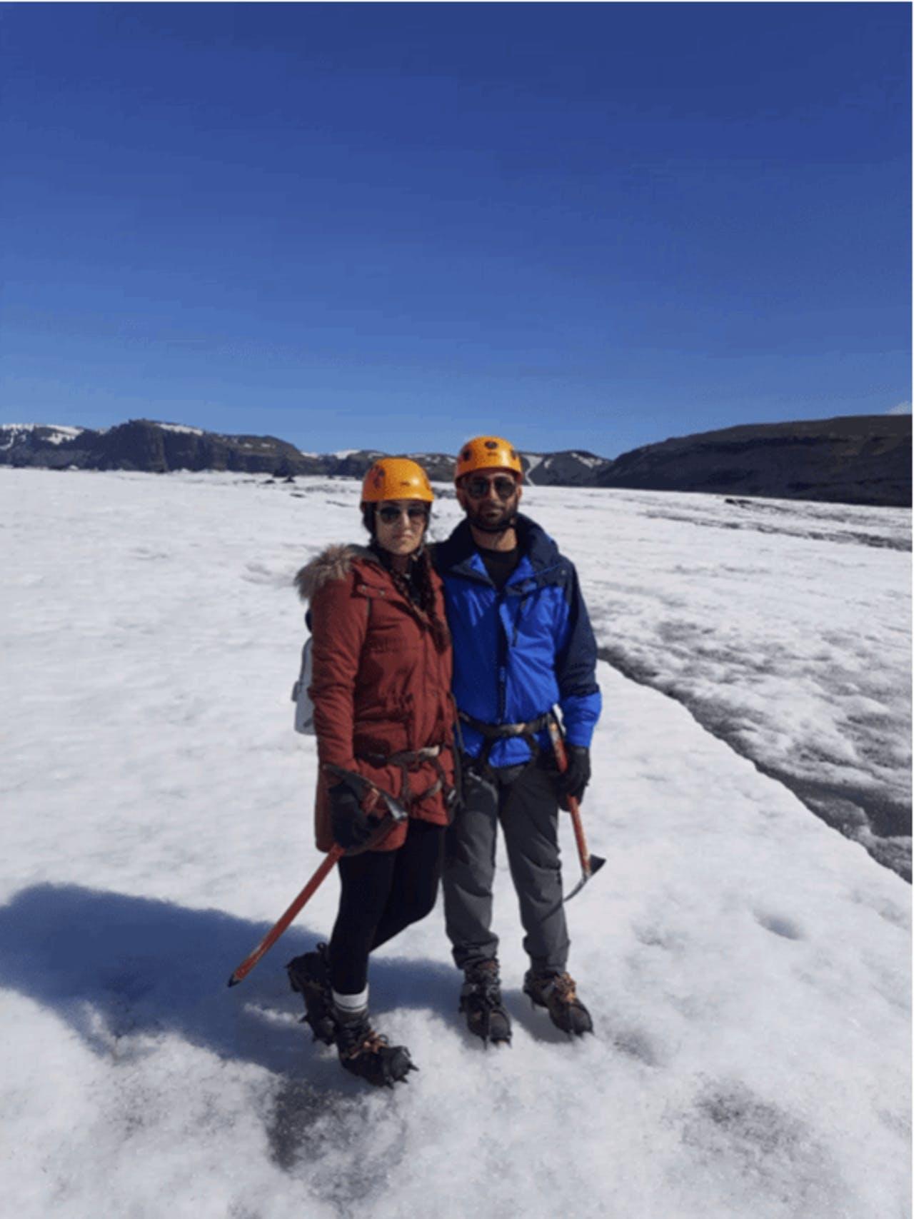 A couple standing on Sólheimajökull