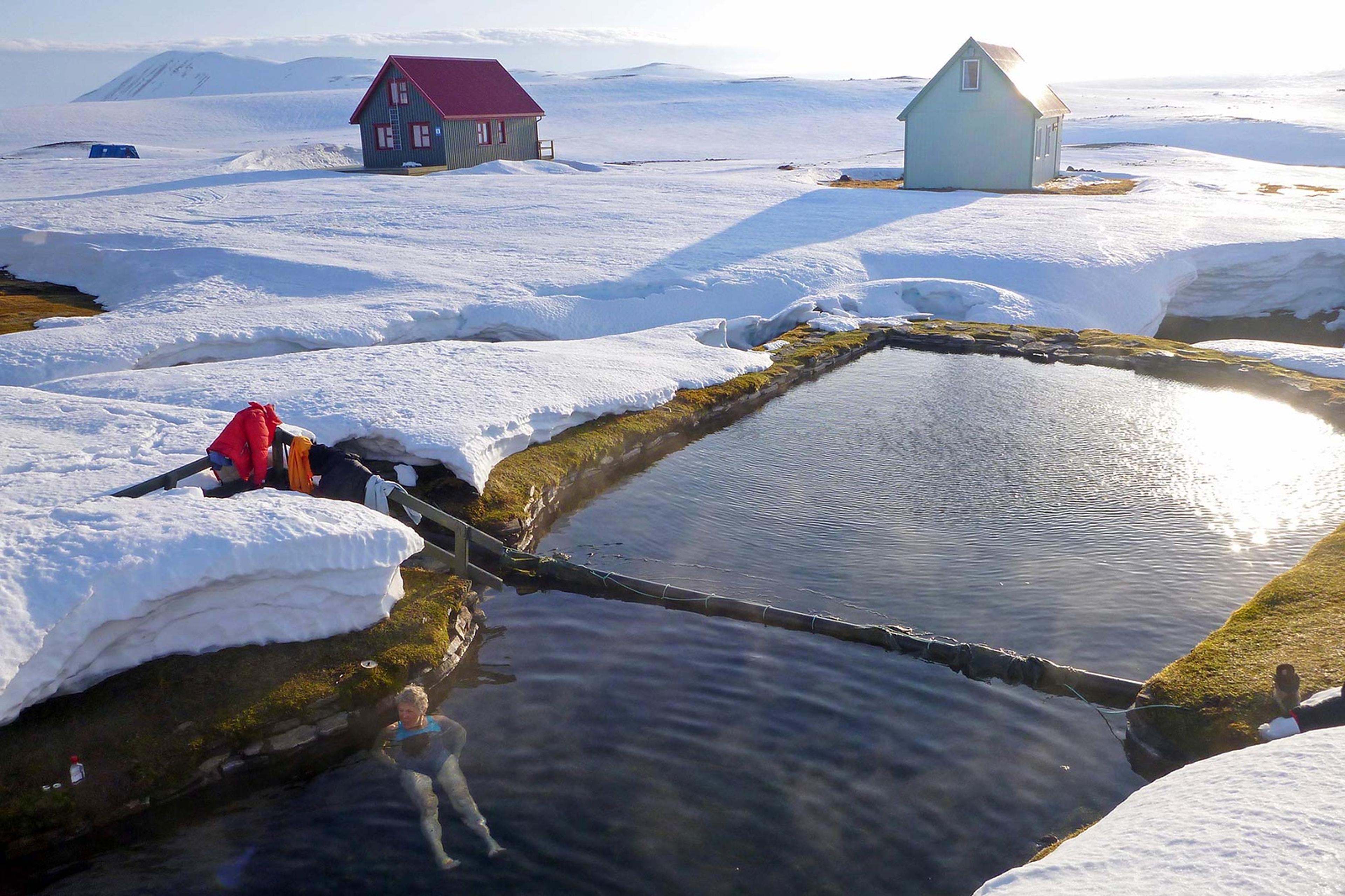 A woman enjoying a hot bath in a natural pool