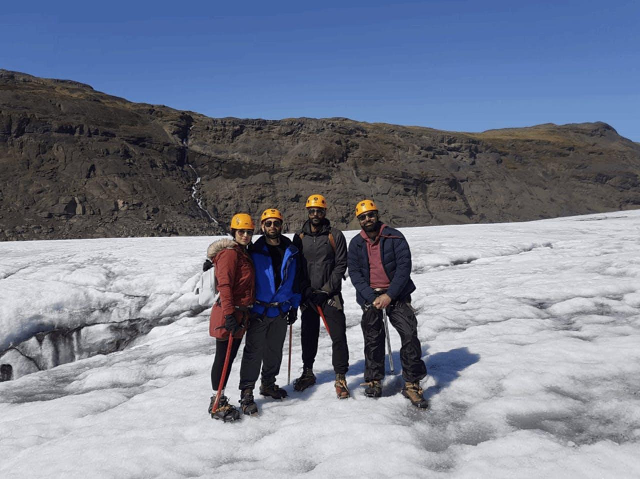 A Group of four people with yellow helmets in Iceland