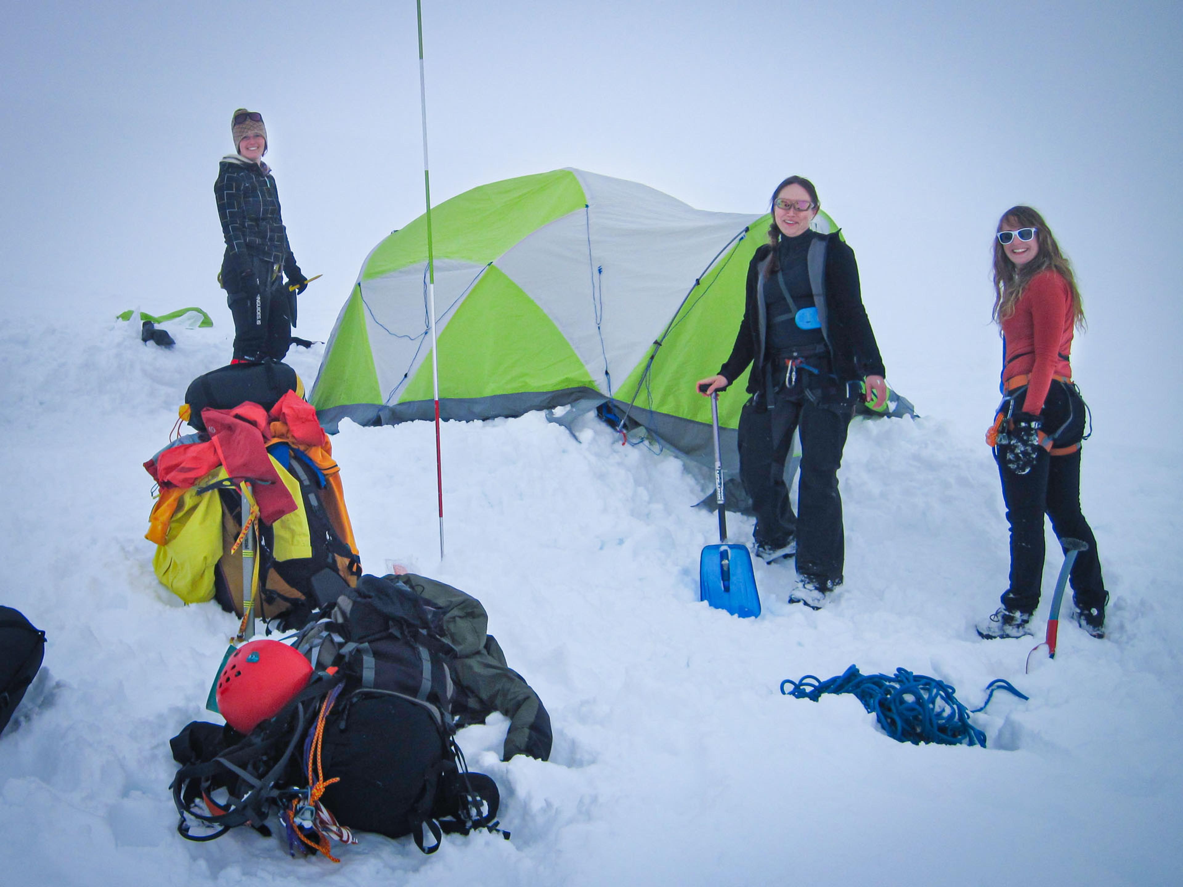 people camping in the snow