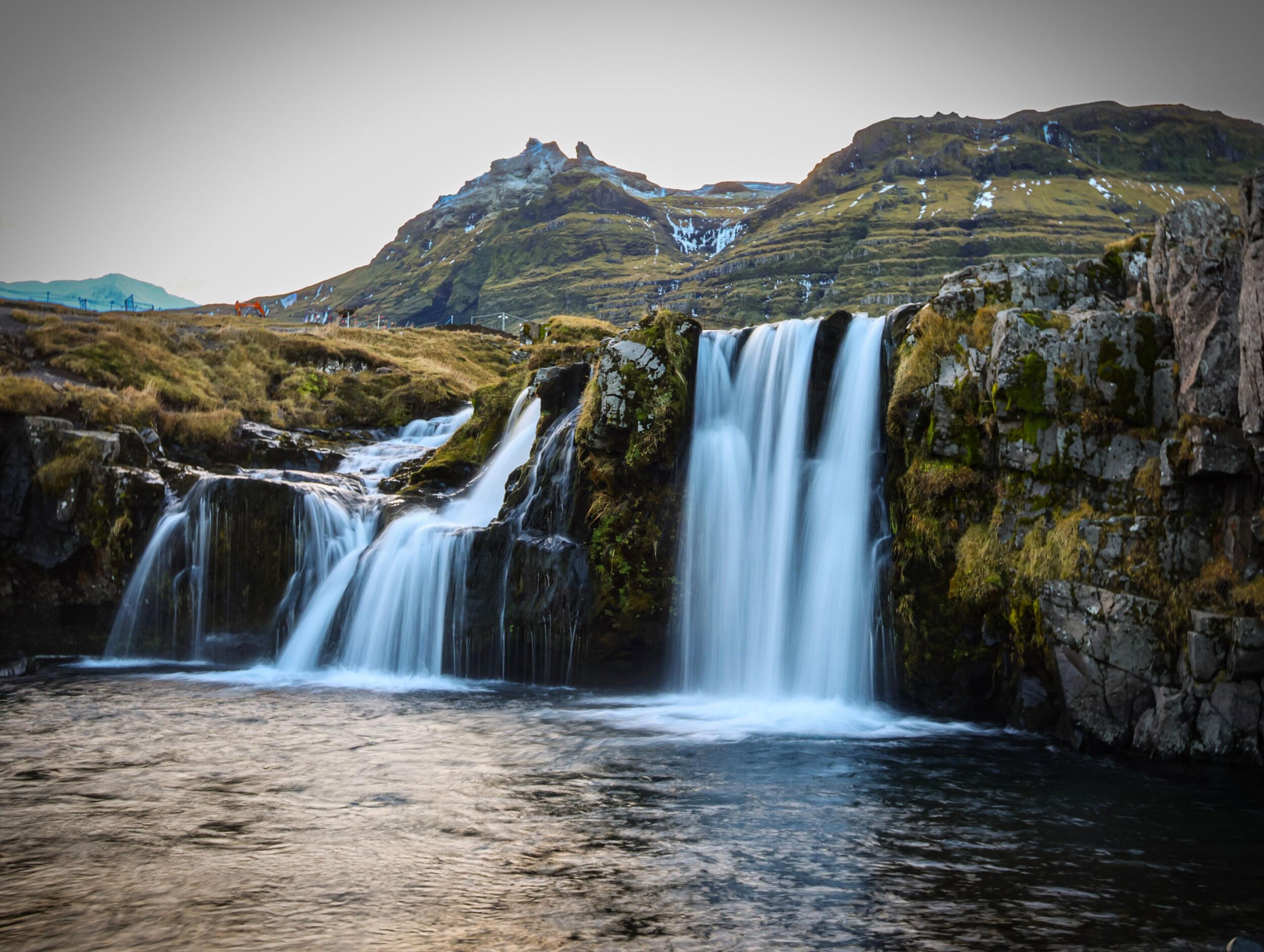 Waterfall coming from a mountain. 
