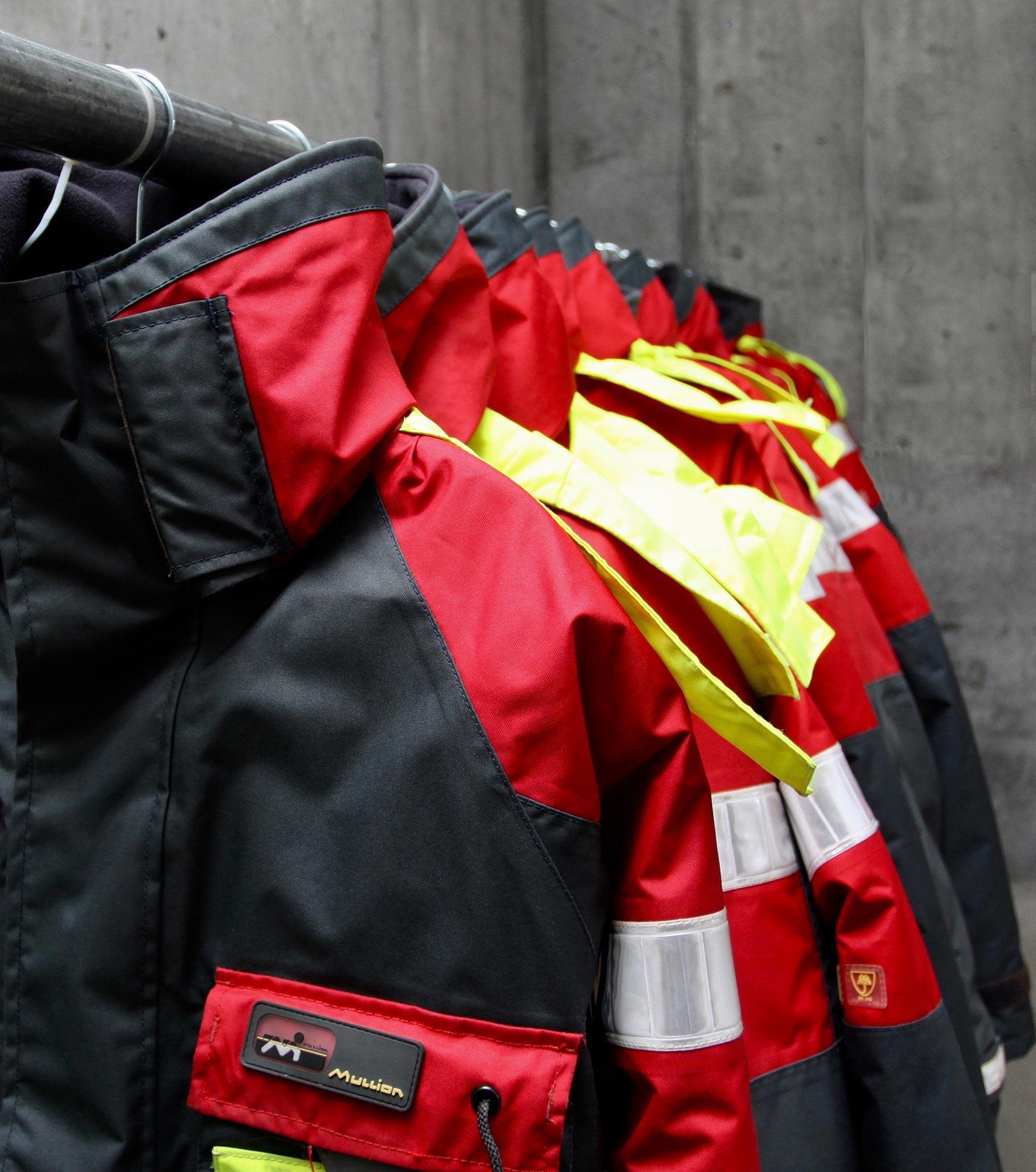 Overalls hanging ready for the clients to use on the boat