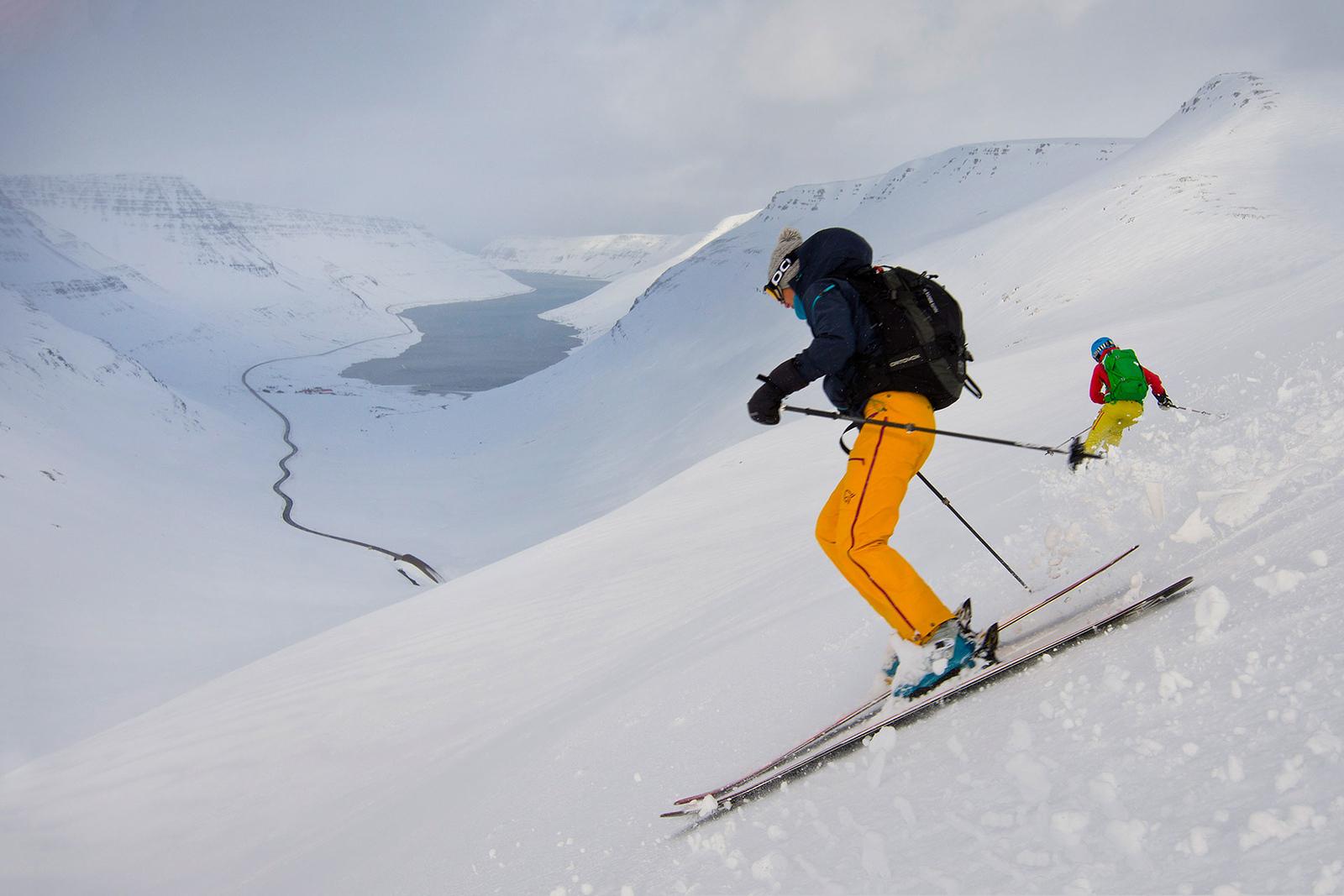 Skiers going down a slope near Siglufjörður