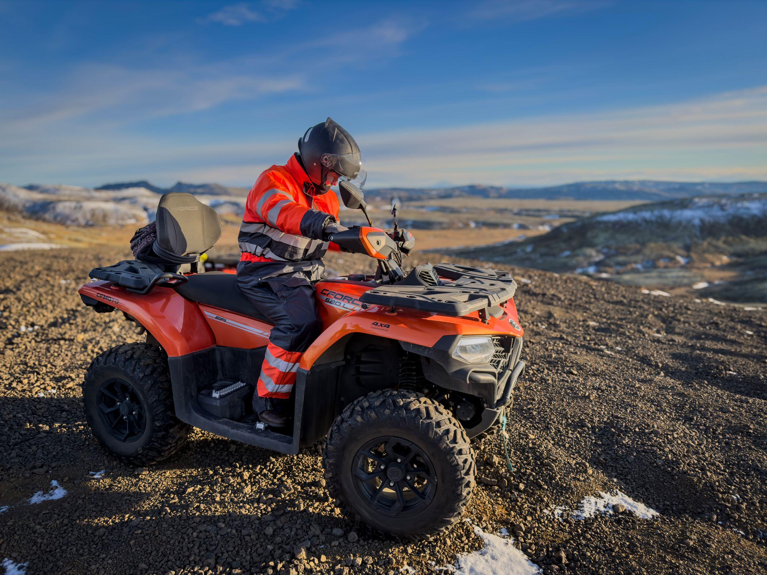 person riding a ATV on a rocky landskape