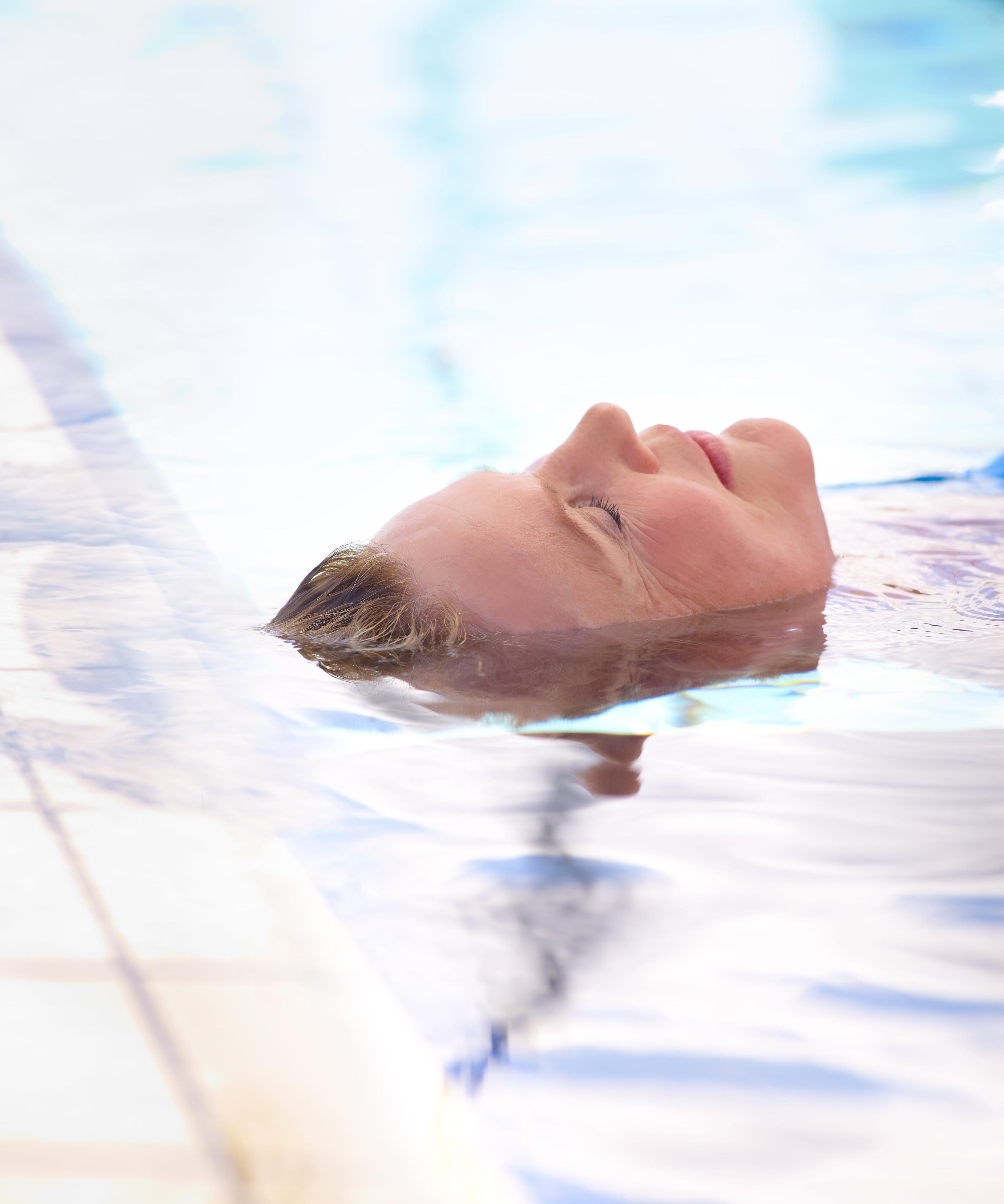 A woman relaxing in the Fontana geothermal baths