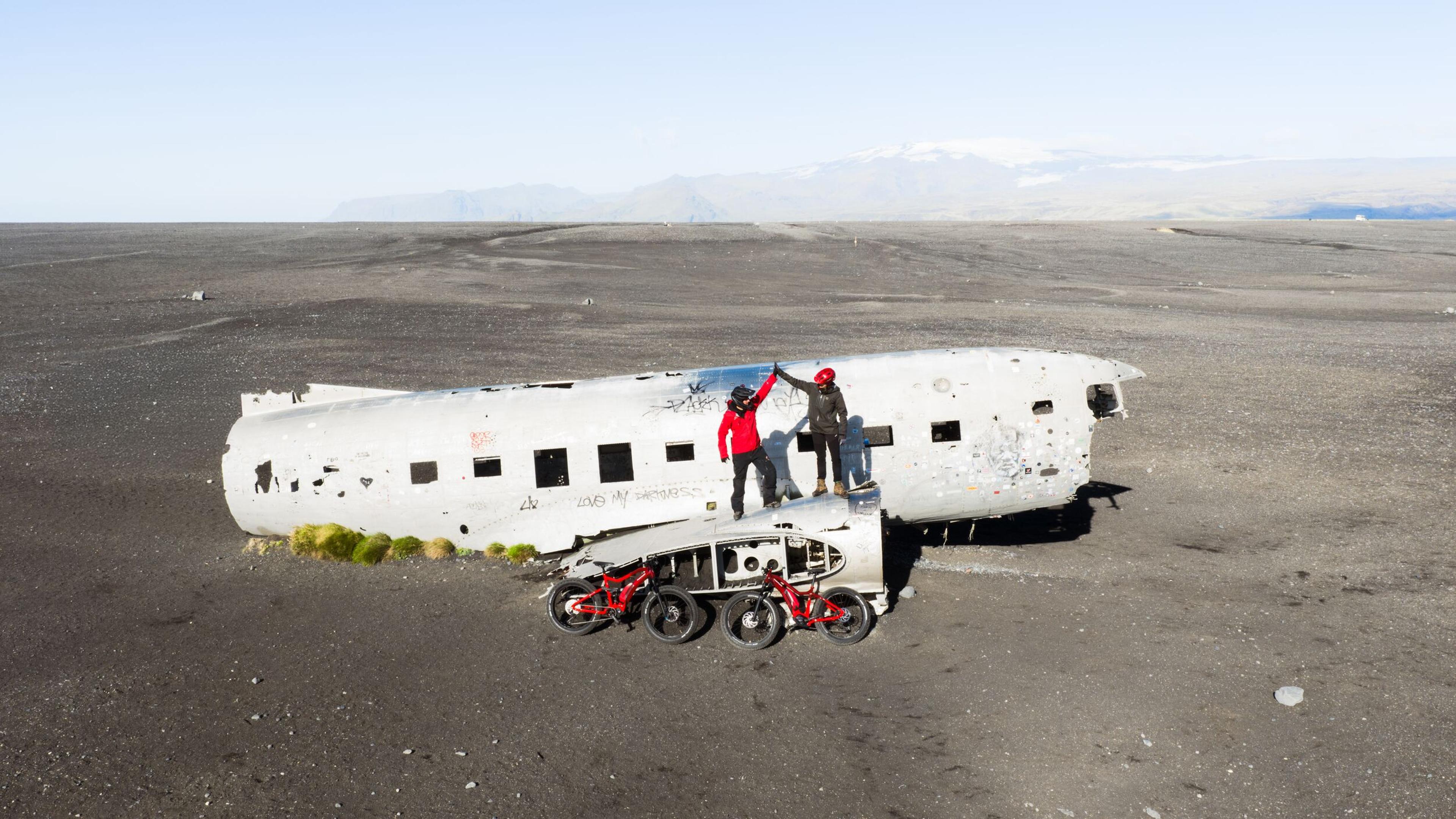 People on a plane wreck on with two bikes