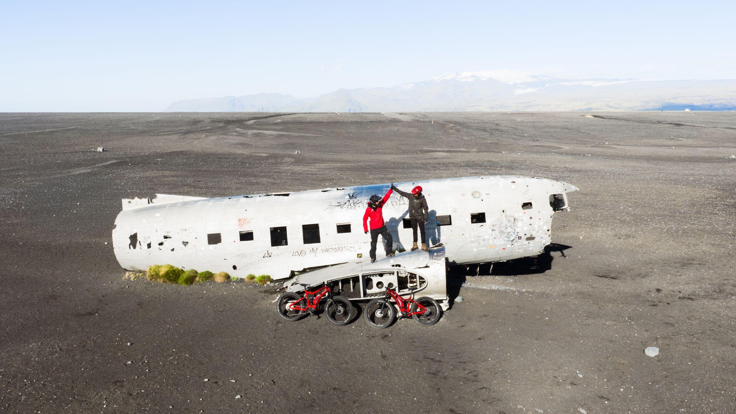 People on a plane wreck on with two bikes