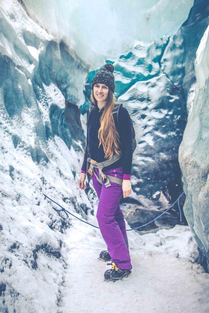 Woman surrounded by glacier ice in Svínafelssjökull