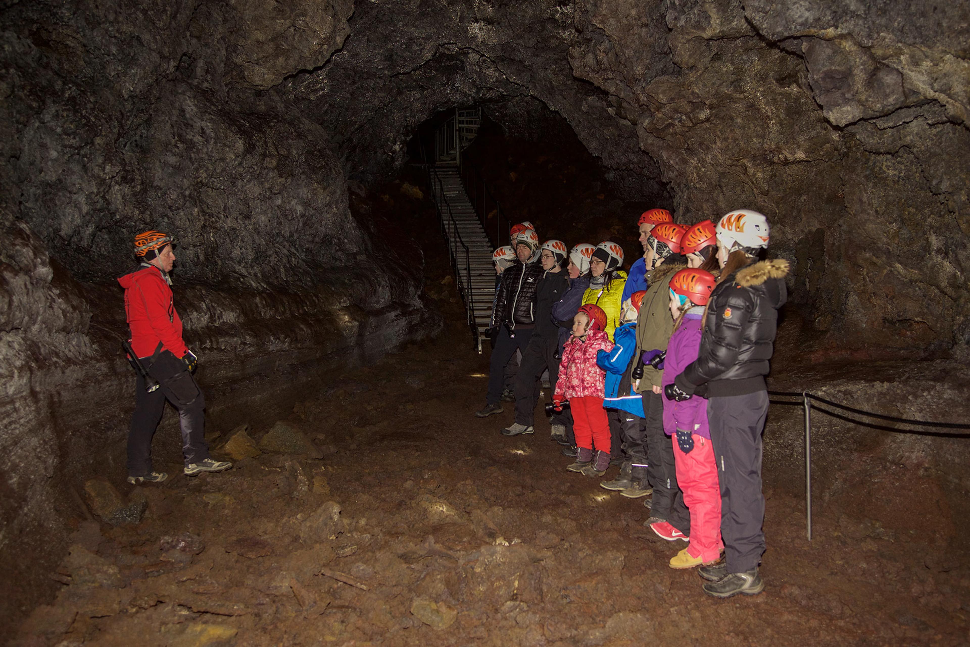 People and a guide enjoying the Vatnshellir lava cave in Snæfellsnes peninsula