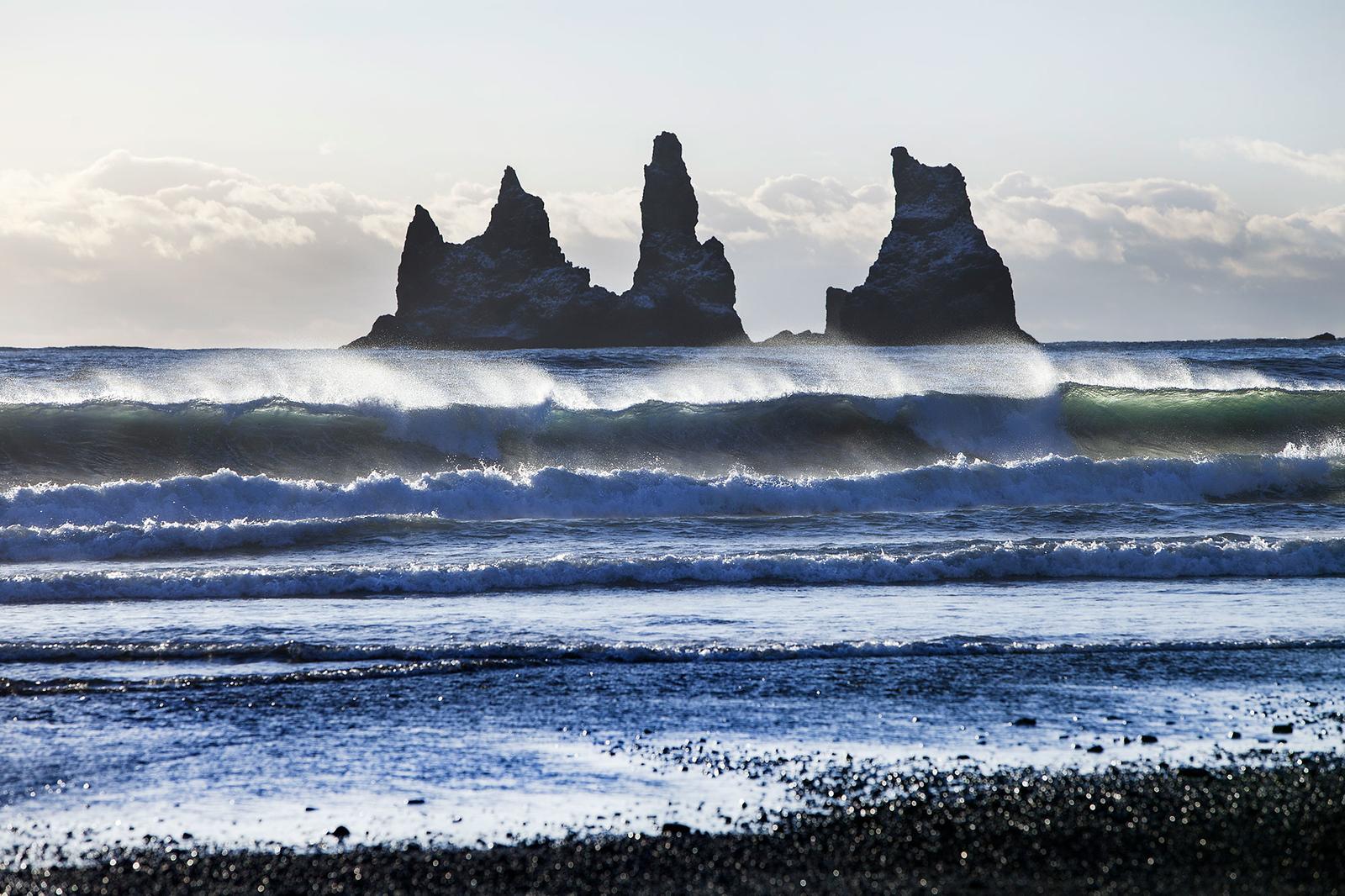 Reynisdrangar sea cliffs near the village of Vík. Waves coming in