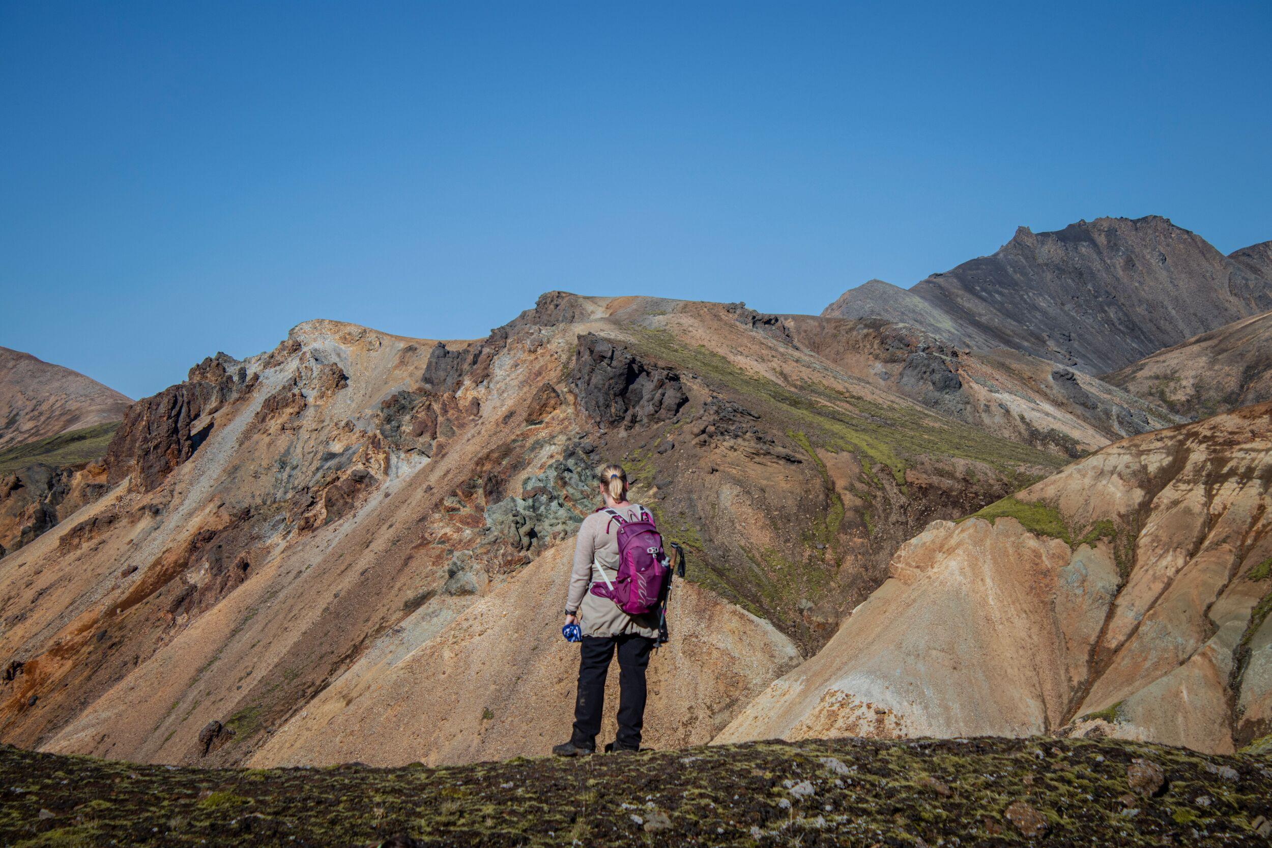 Person standing on a mountain on a highland
