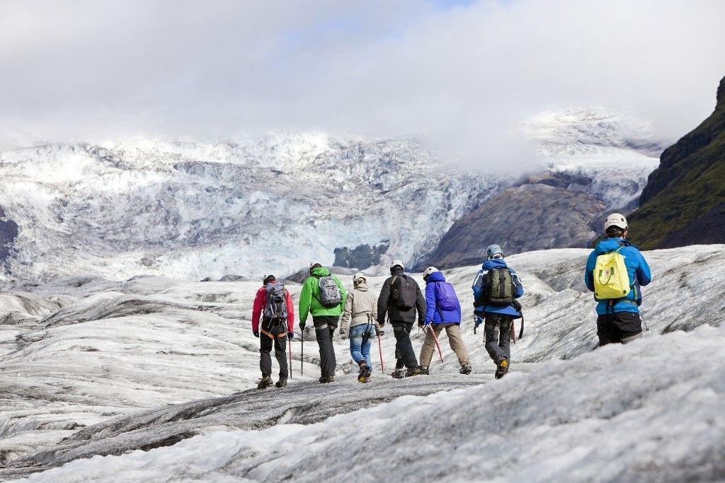 A group of people hiking on a glacier in Skaftafell, Iceland