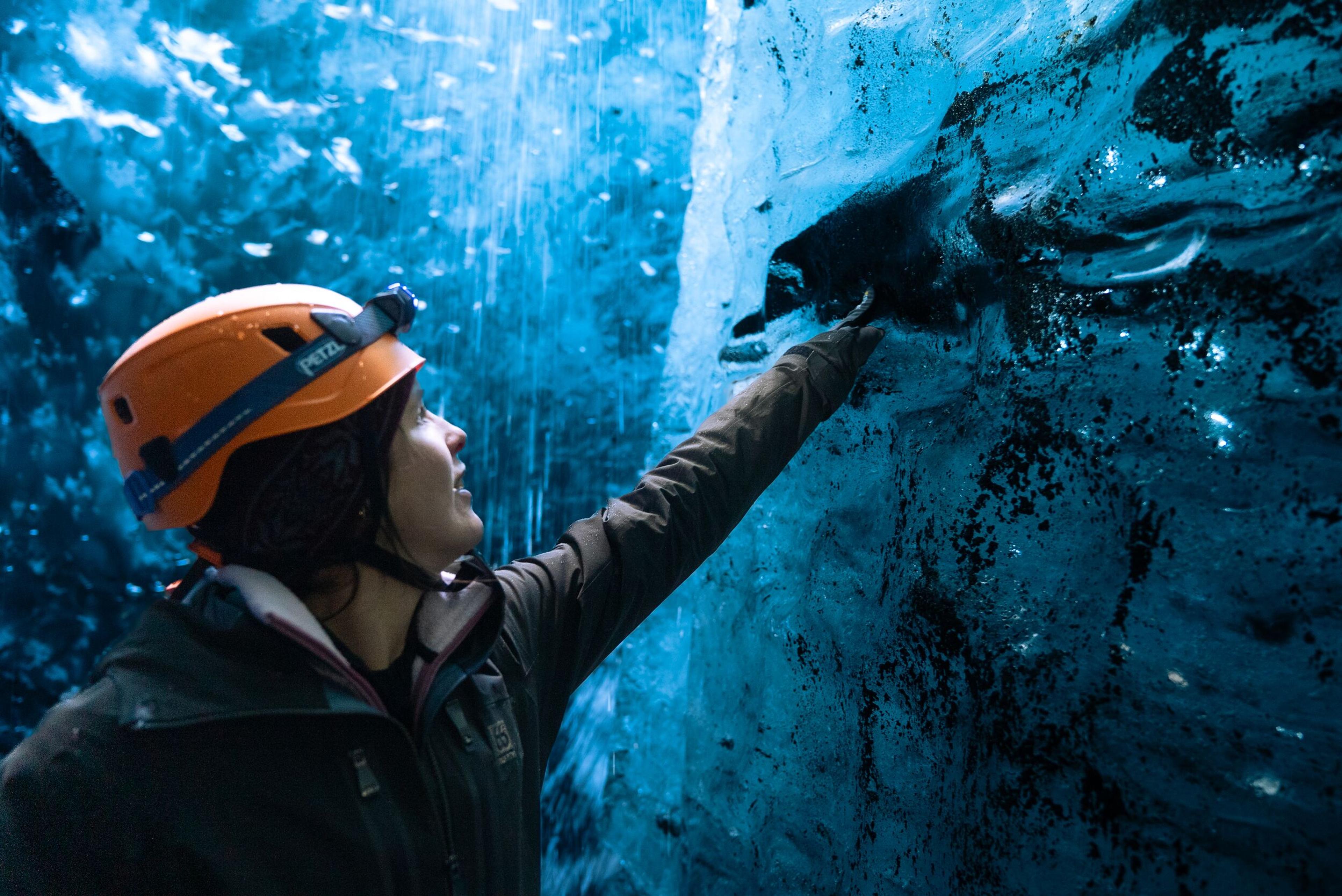 women with her hand on the blue ice