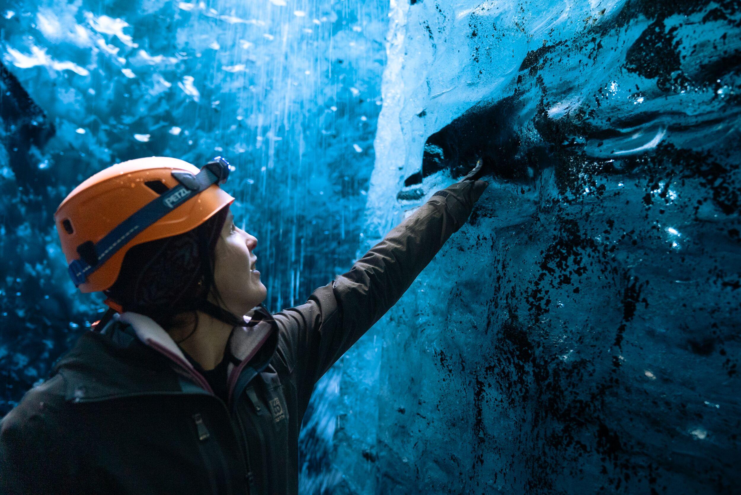 women with her hand on the blue ice