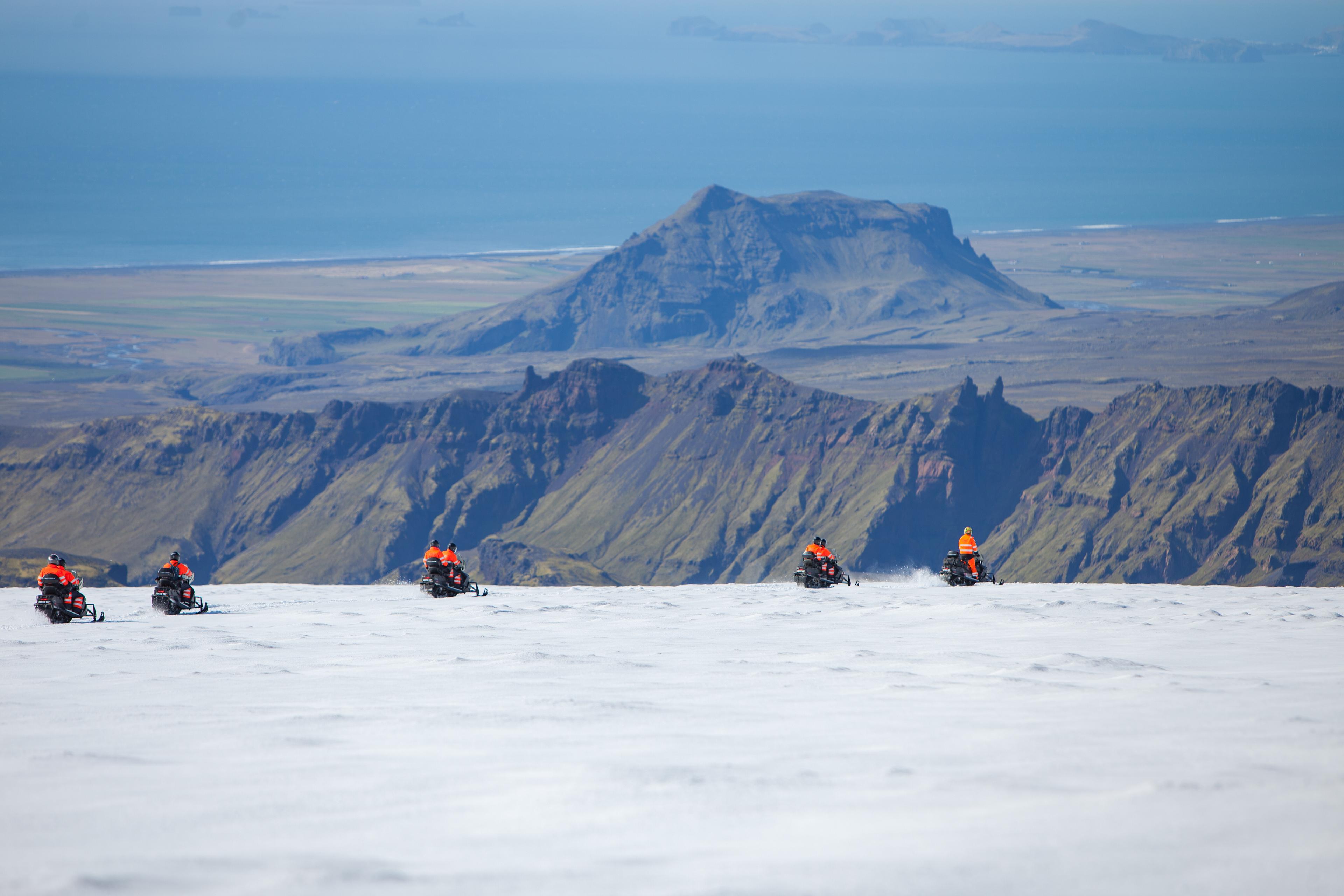 Skidoo group heading further down the glacier on their way back to base