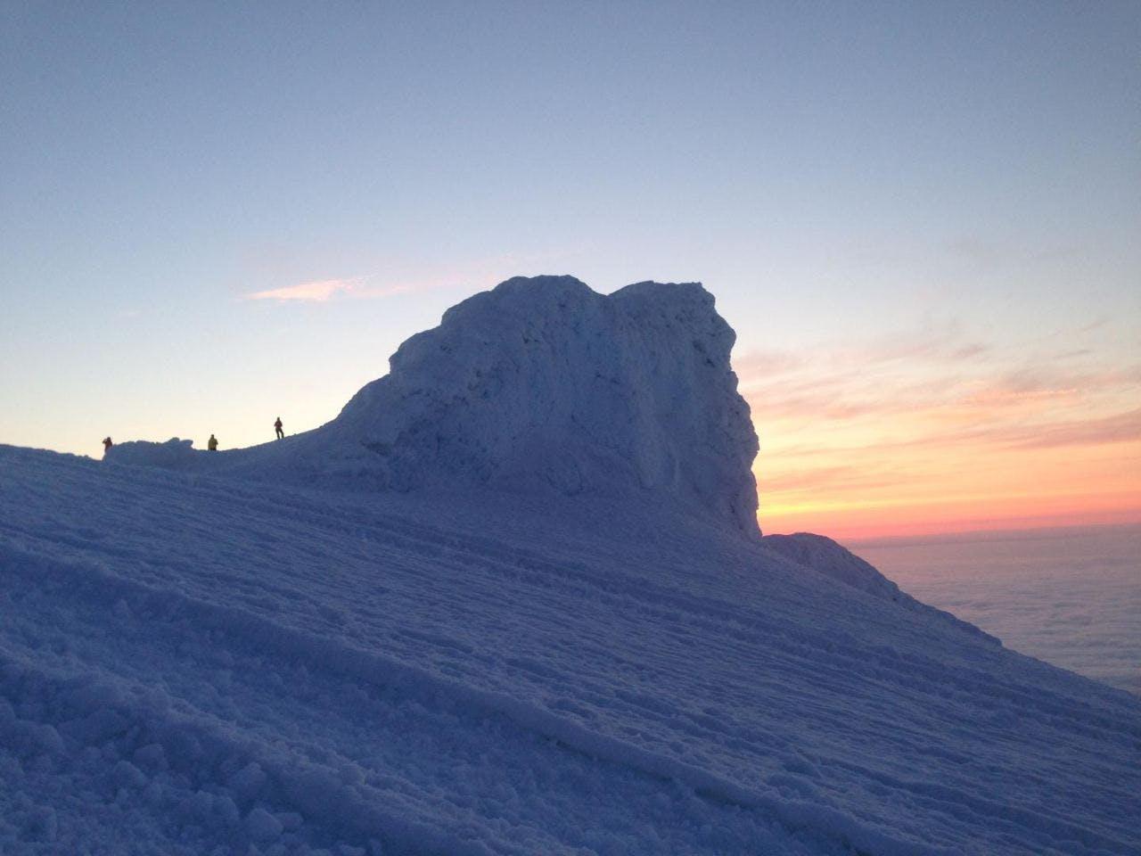 People hiking to the snowy top of Snæfellsjökull glacier on a tour with Icelandic Mountain Guides