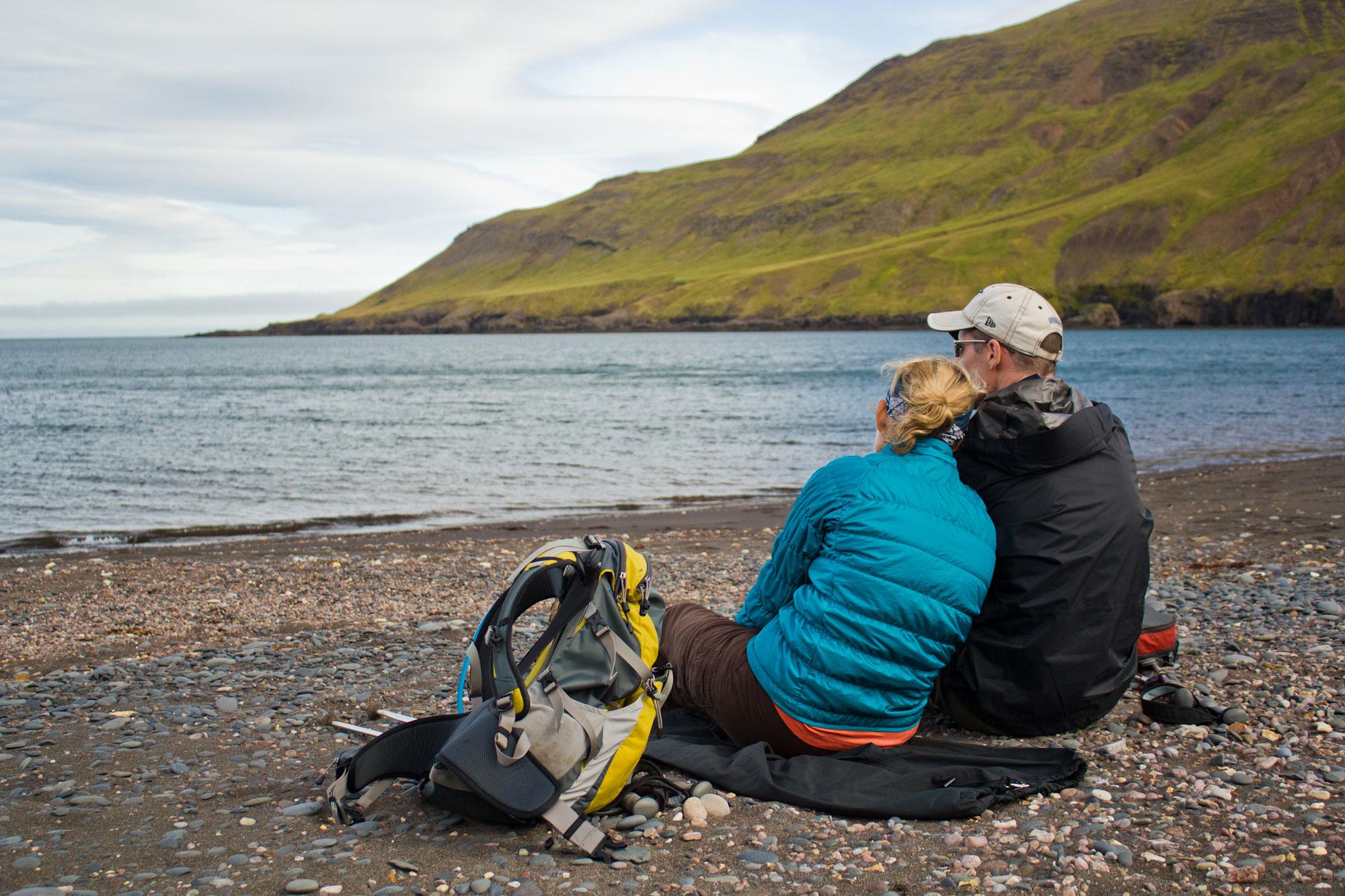 A woman river crossing barefoot in Iceland