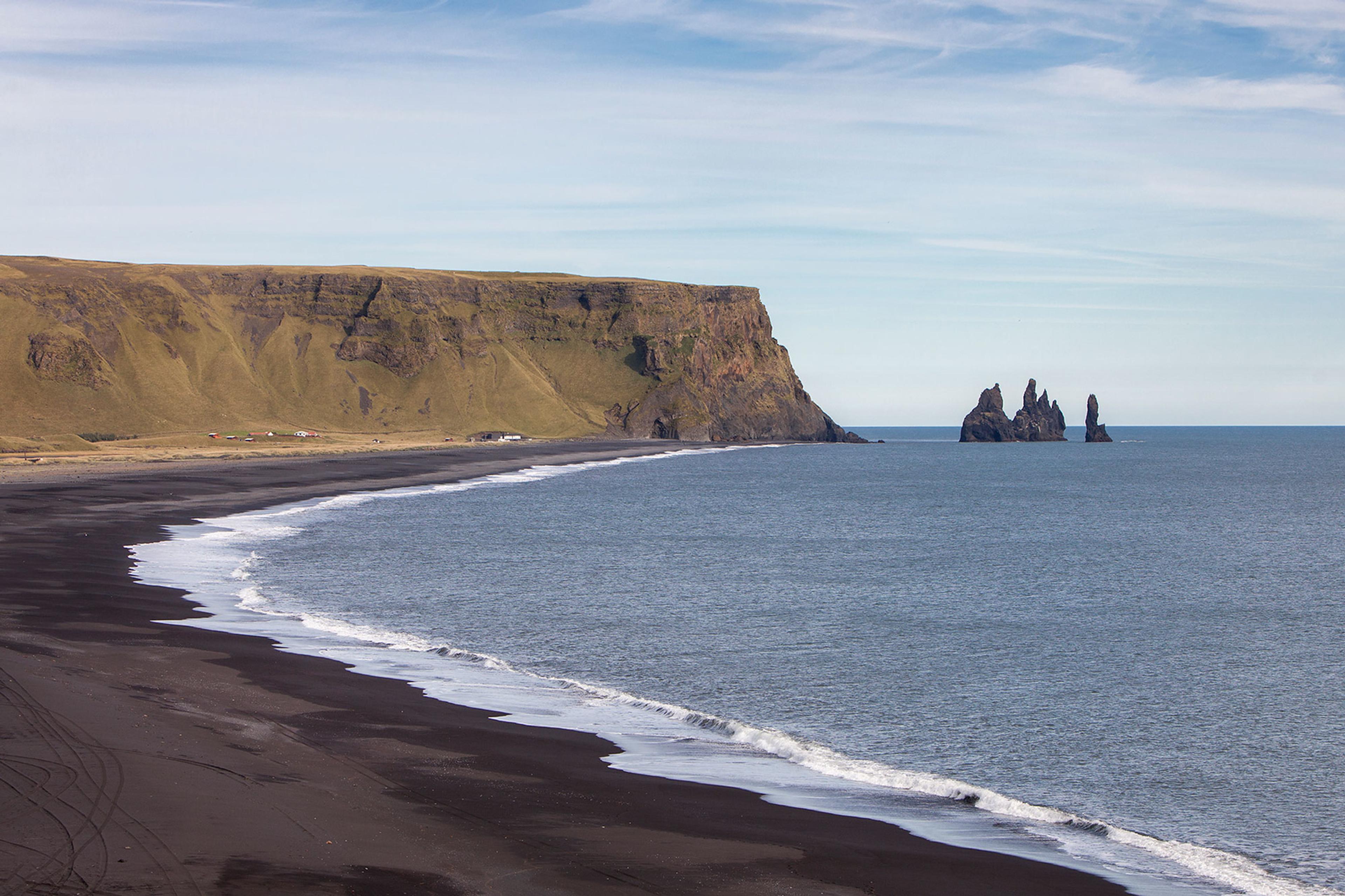 Reynisfjara black sand beach and Reynisdrangar sea cliffs in the distance