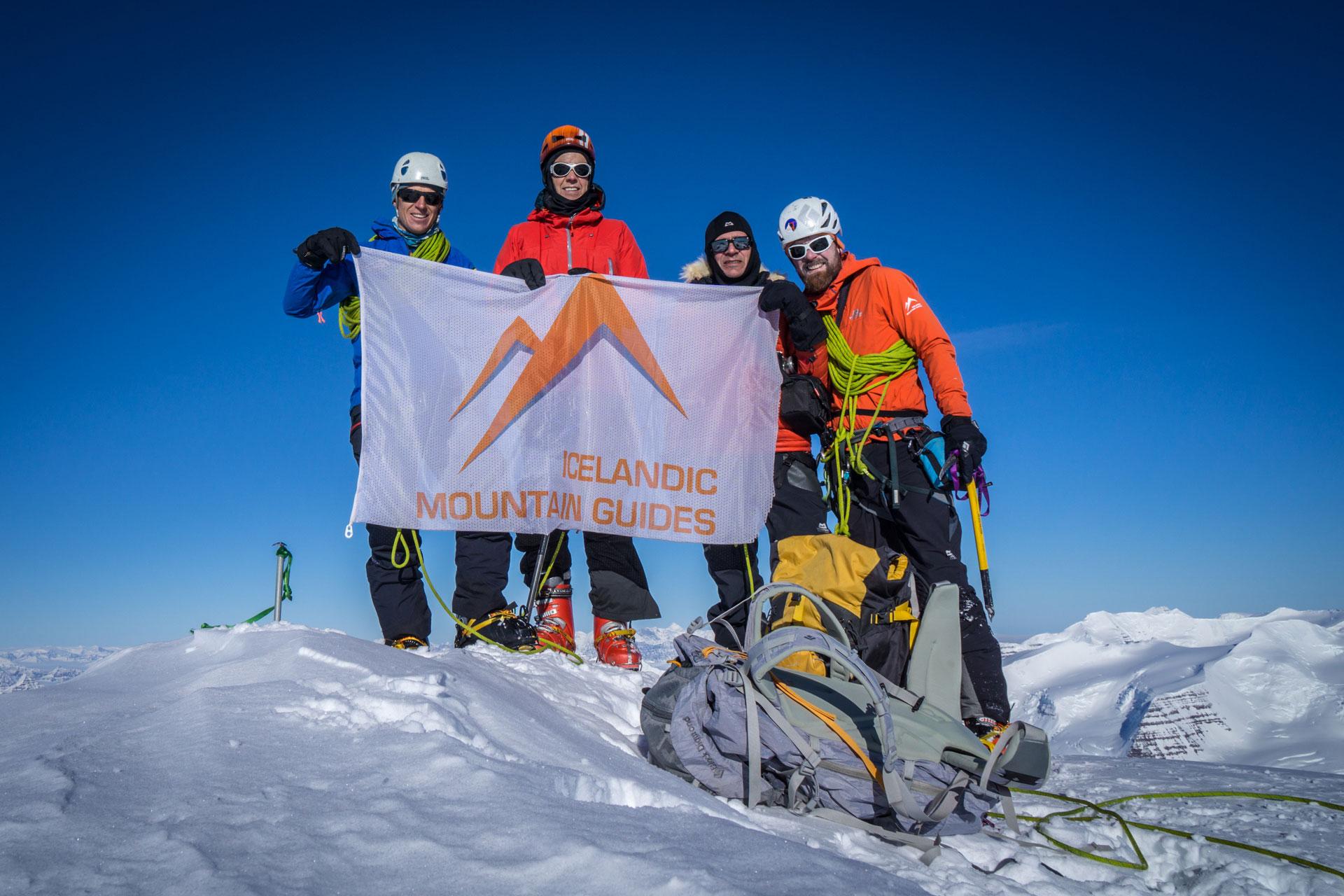 The team standing on top of the highest peak in the artic