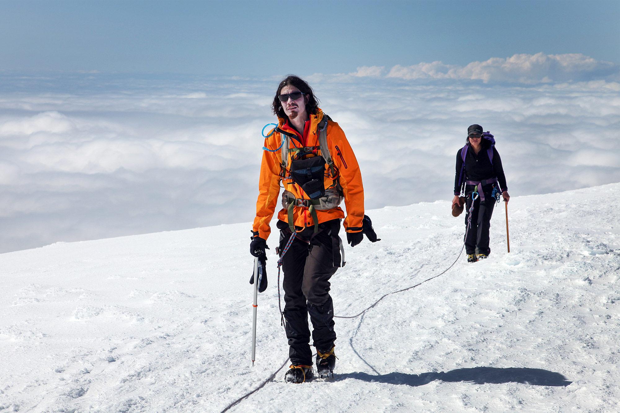 Two hikers going down Hvannadalshnúkur mountain in Iceland.