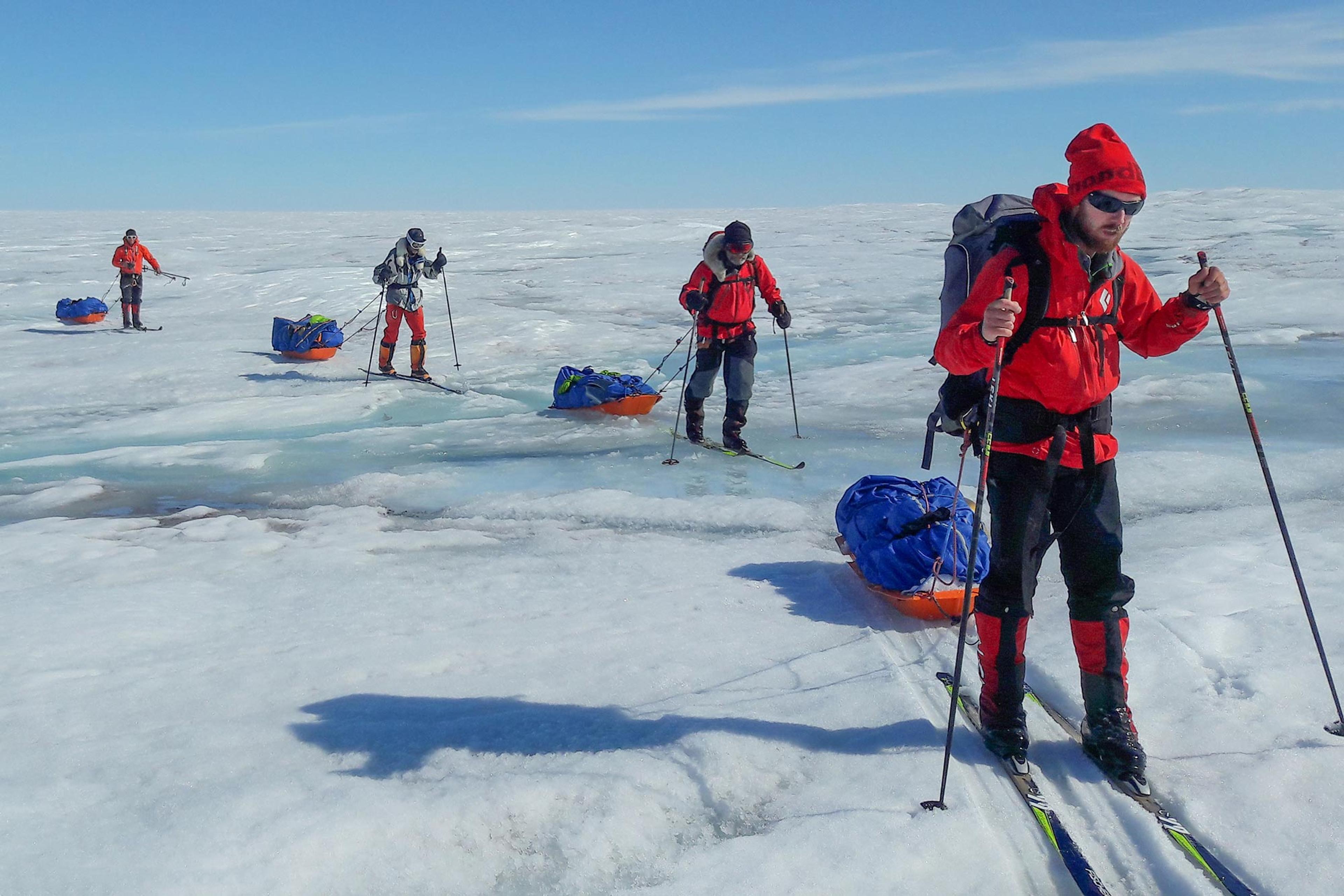 Skiers going through a wet section on the glacier
