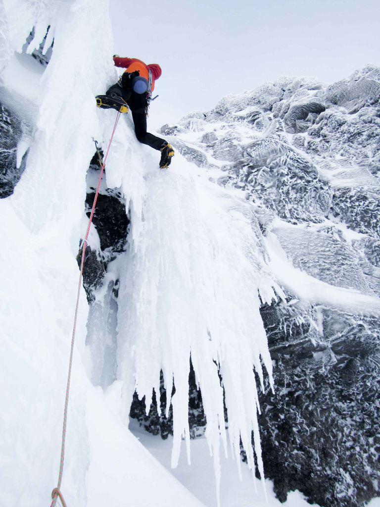 Matteo climbing up the frozen waterfall