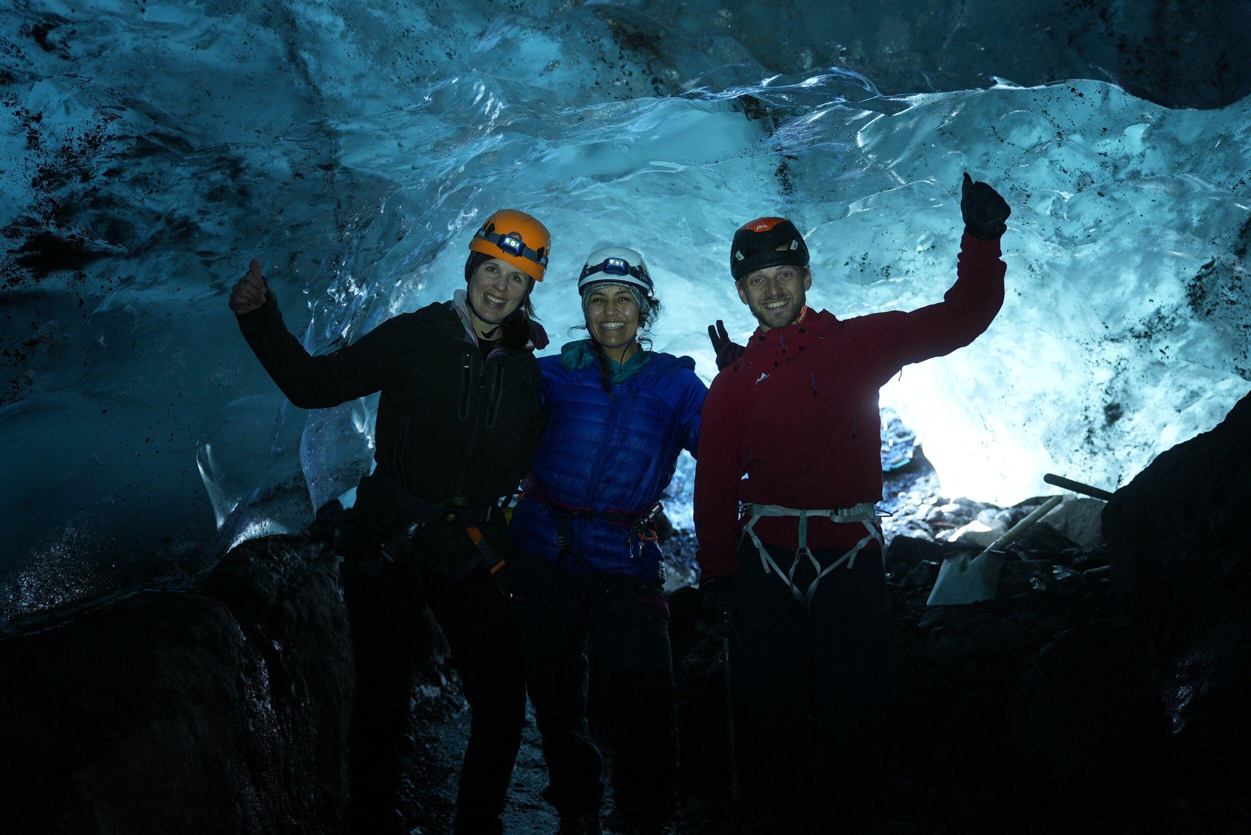 Icelandic Mountain Guide with guests inside an ice cave