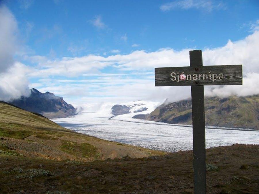 Sign that sais Sjónarnípa with glacier in background