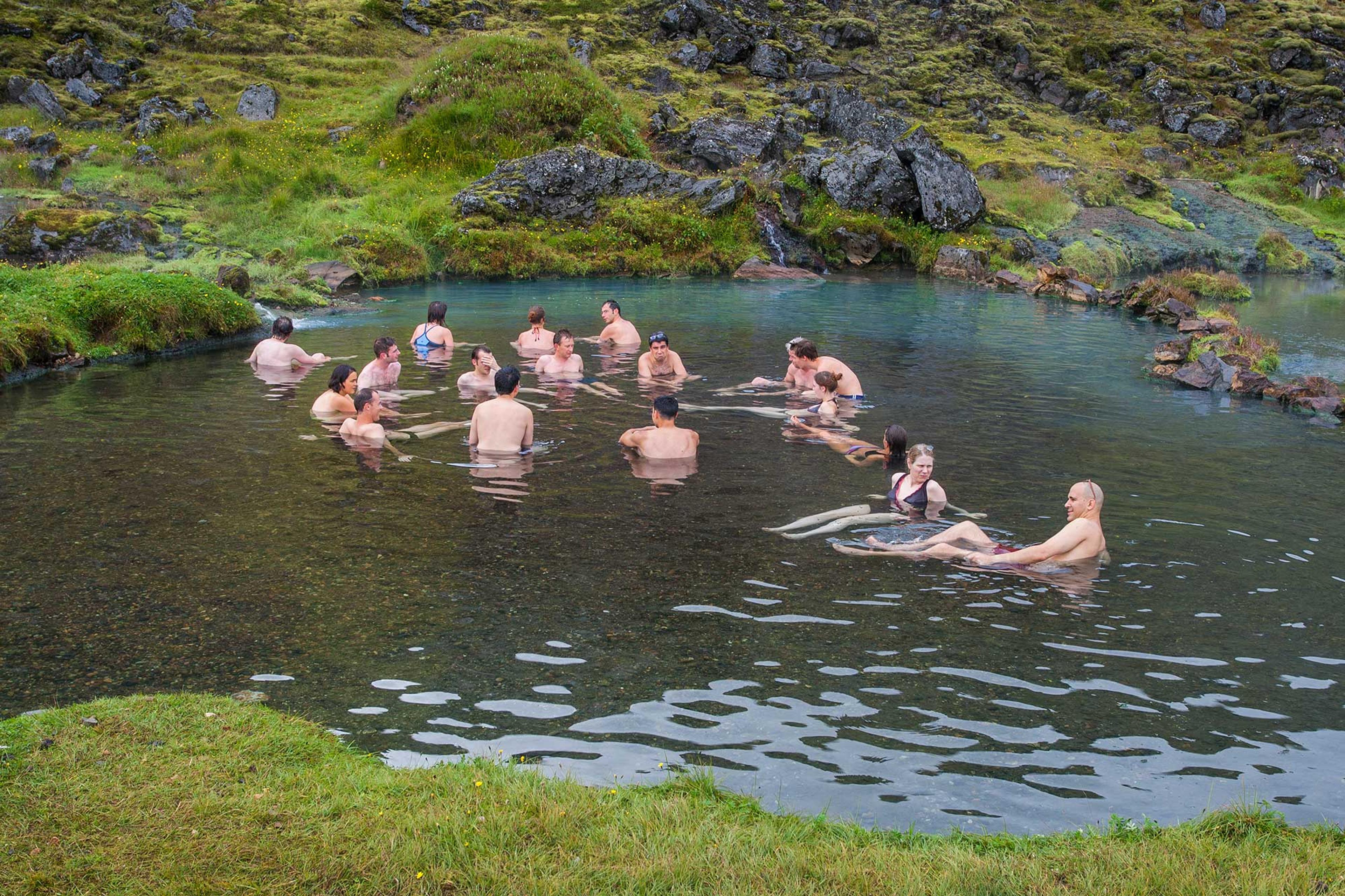 People enjoying the hot pool in Landmannalaugar area